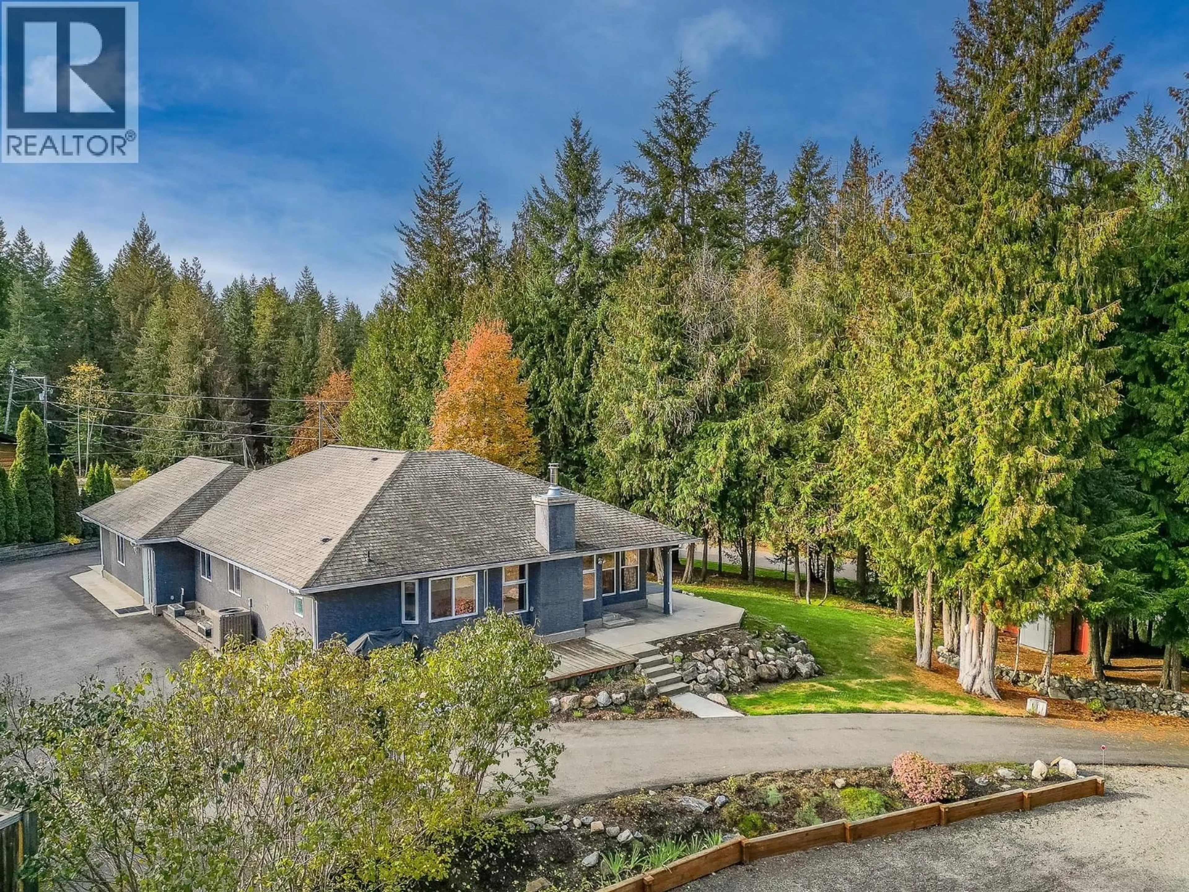 A pic from outside/outdoor area/front of a property/back of a property/a pic from drone, forest/trees view for 15 PARSONS ROAD, Mara British Columbia V0E2K0