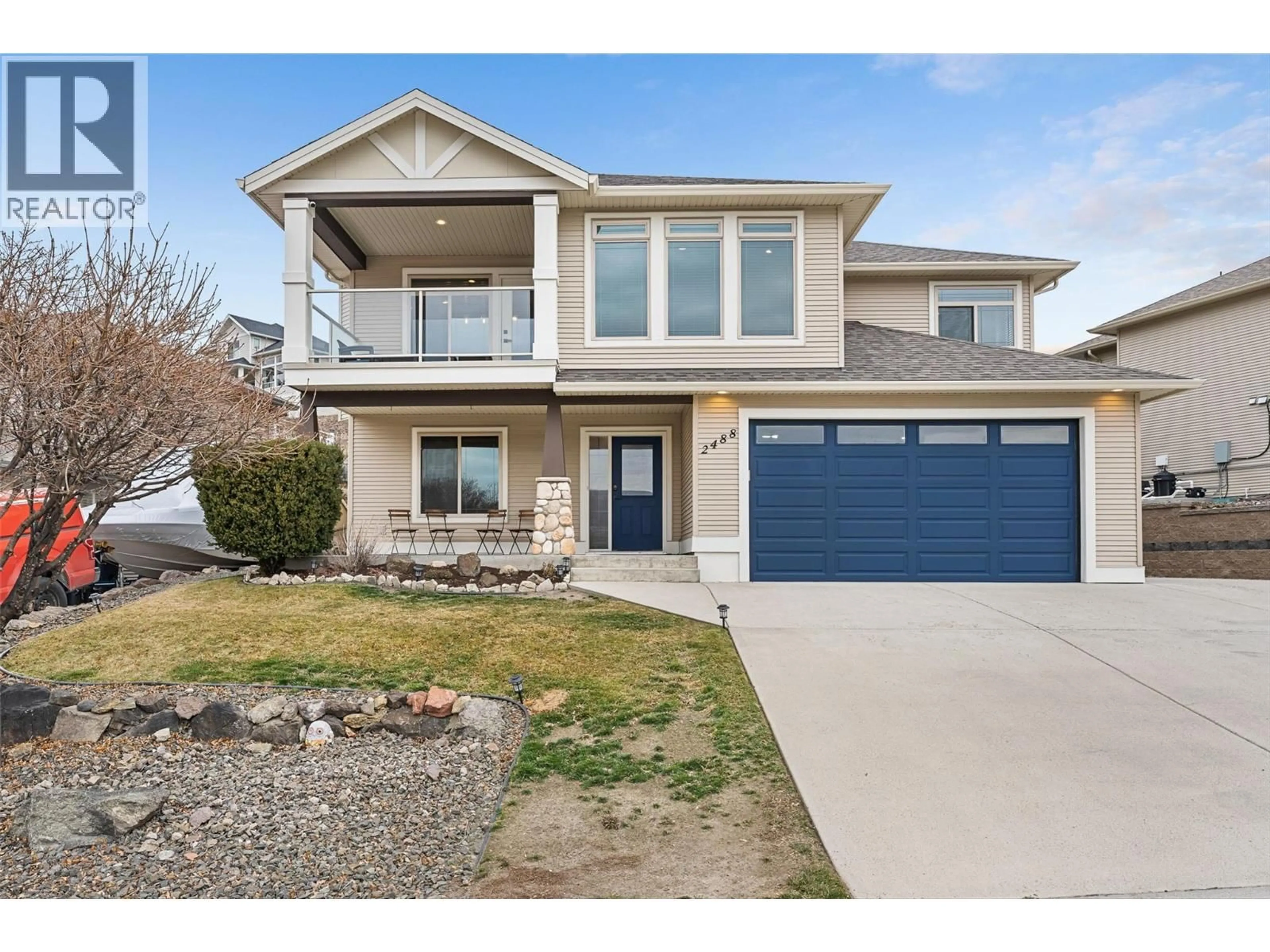 Home with vinyl exterior material, street for 2488 IRONRIDGE ROAD, West Kelowna British Columbia V4T2Y4