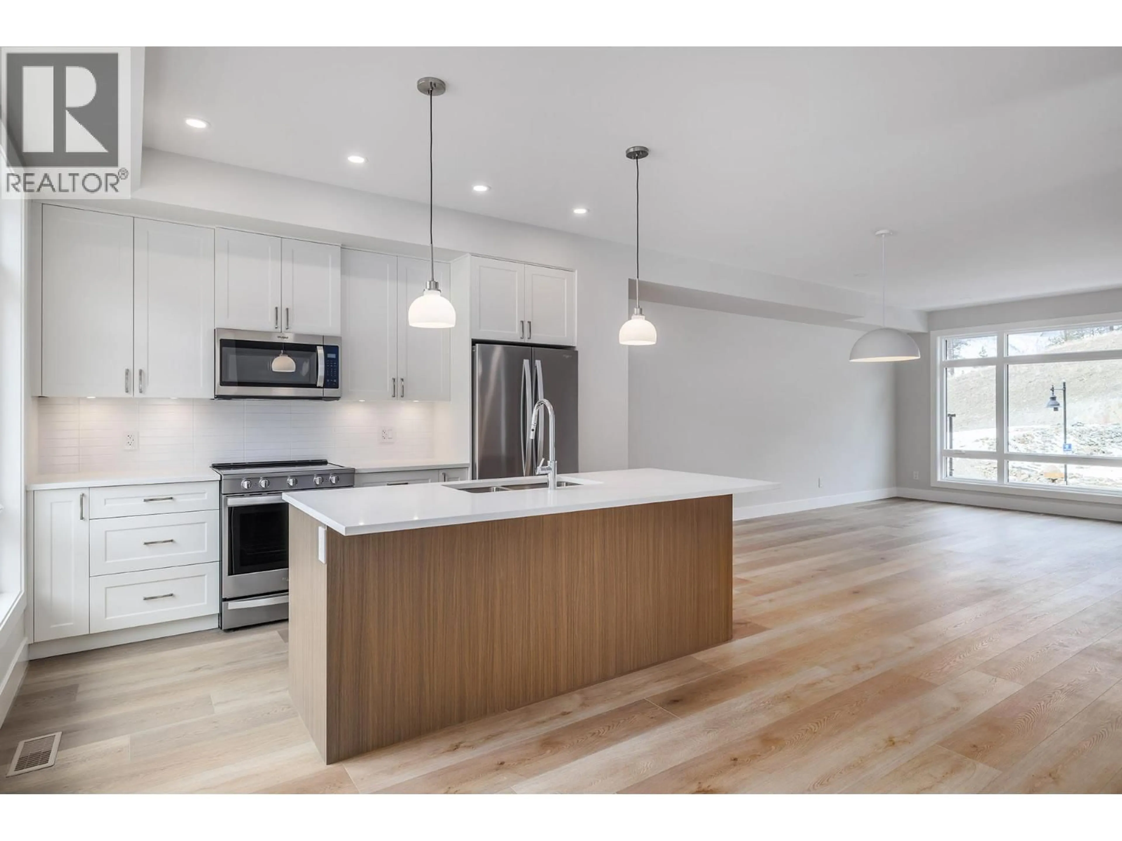 Open concept kitchen, wood/laminate floor for 5 - 3425 HILLTOWN DRIVE, Kelowna British Columbia V1V2B5