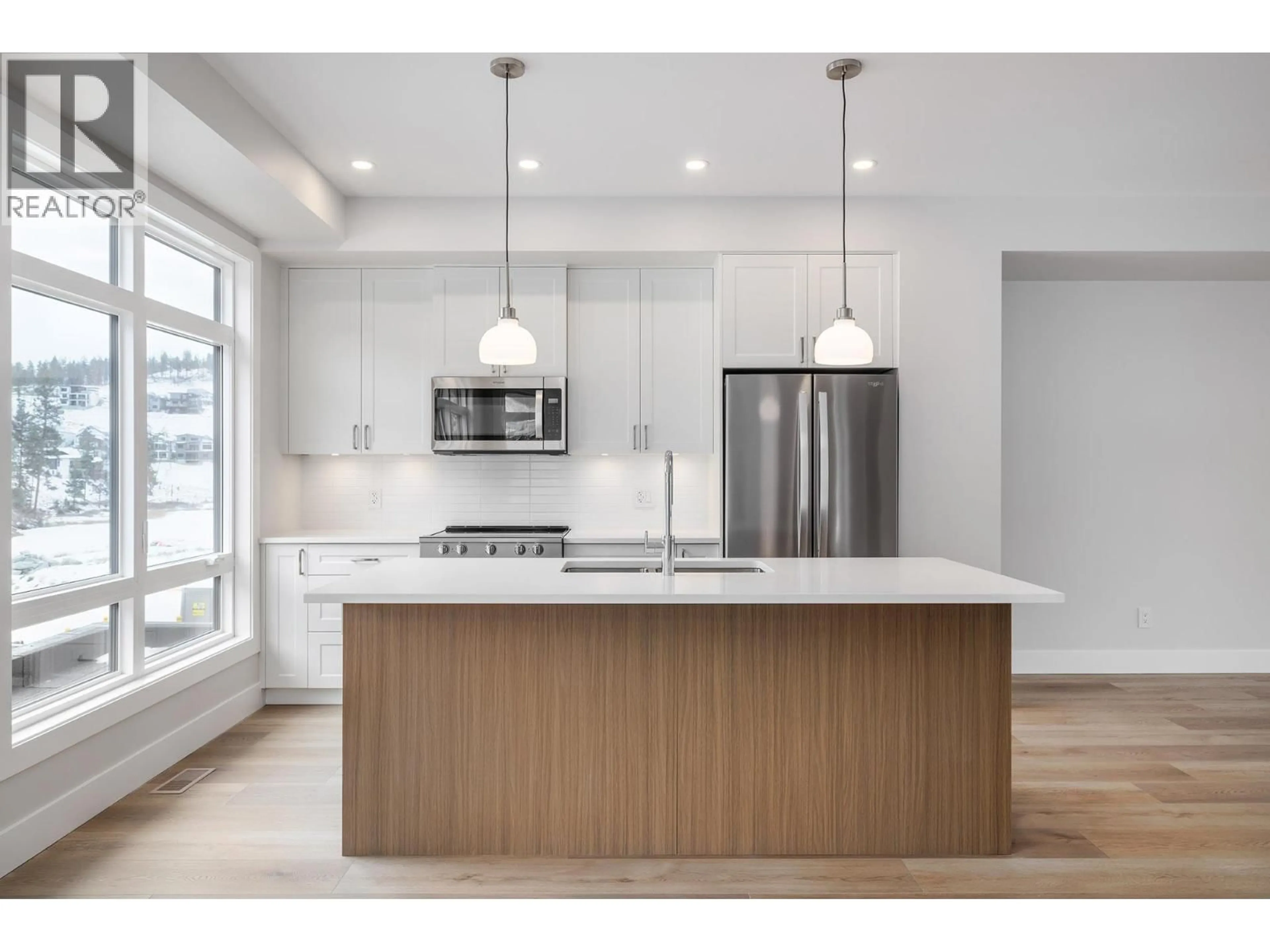 Open concept kitchen, wood/laminate floor for 5 - 3425 HILLTOWN DRIVE, Kelowna British Columbia V1V2B5