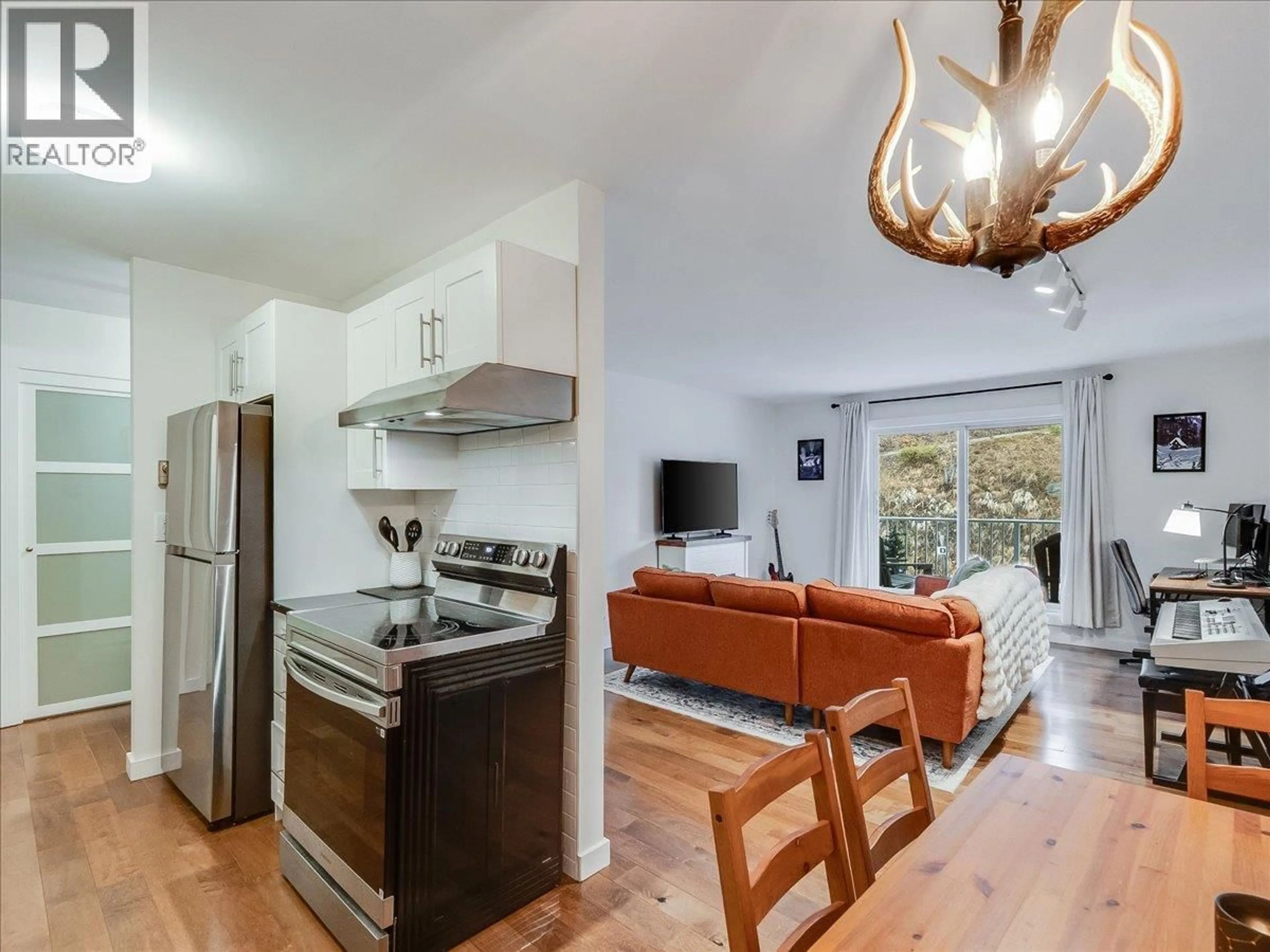 Open concept kitchen, wood/laminate floor for 404 - 1611 NICKLEPLATE ROAD, Rossland British Columbia V0G1Y0