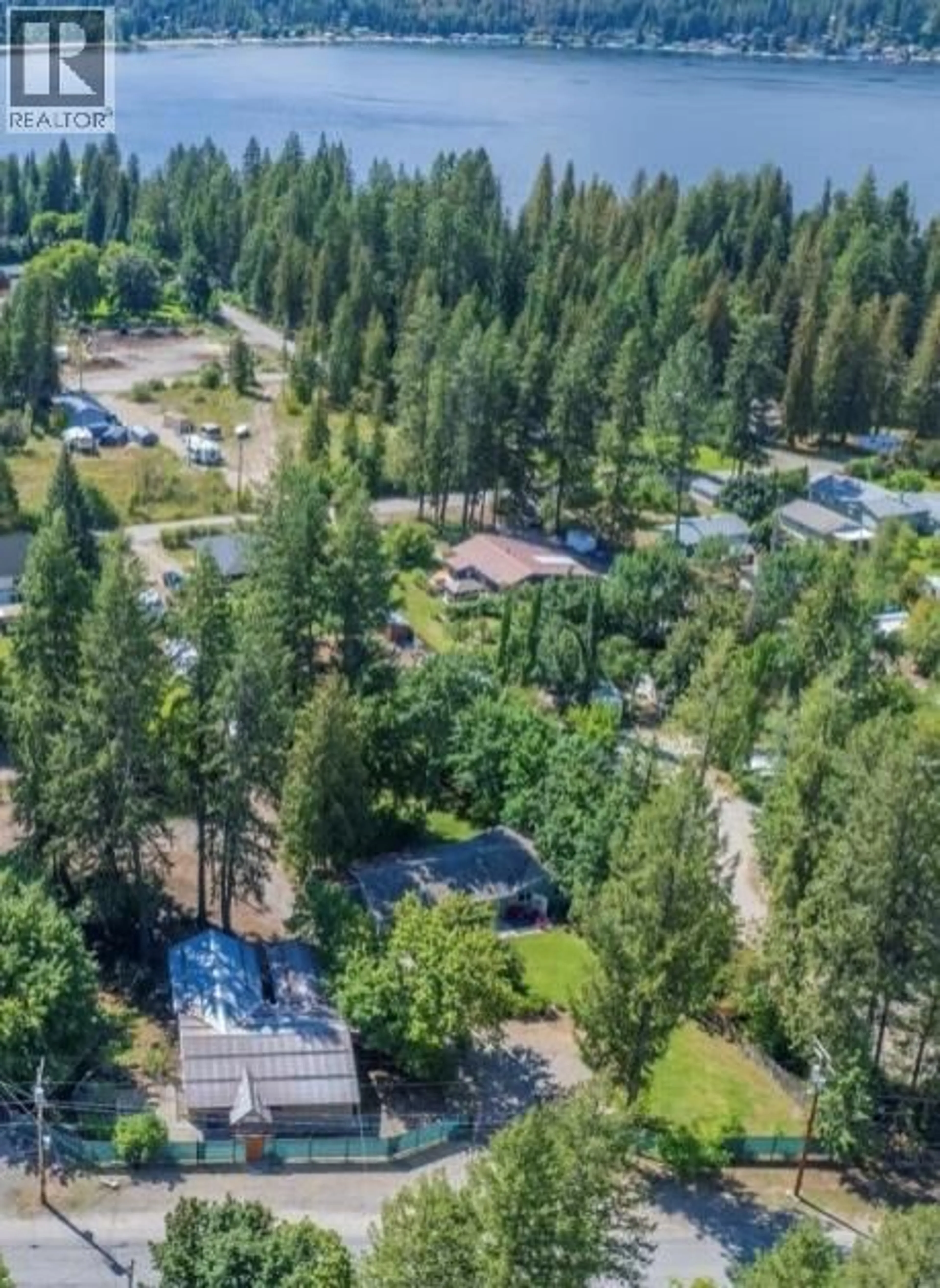 A pic from outside/outdoor area/front of a property/back of a property/a pic from drone, forest/trees view for 9&11 KINGSLEY ROAD, Christina Lake British Columbia V0H1E0