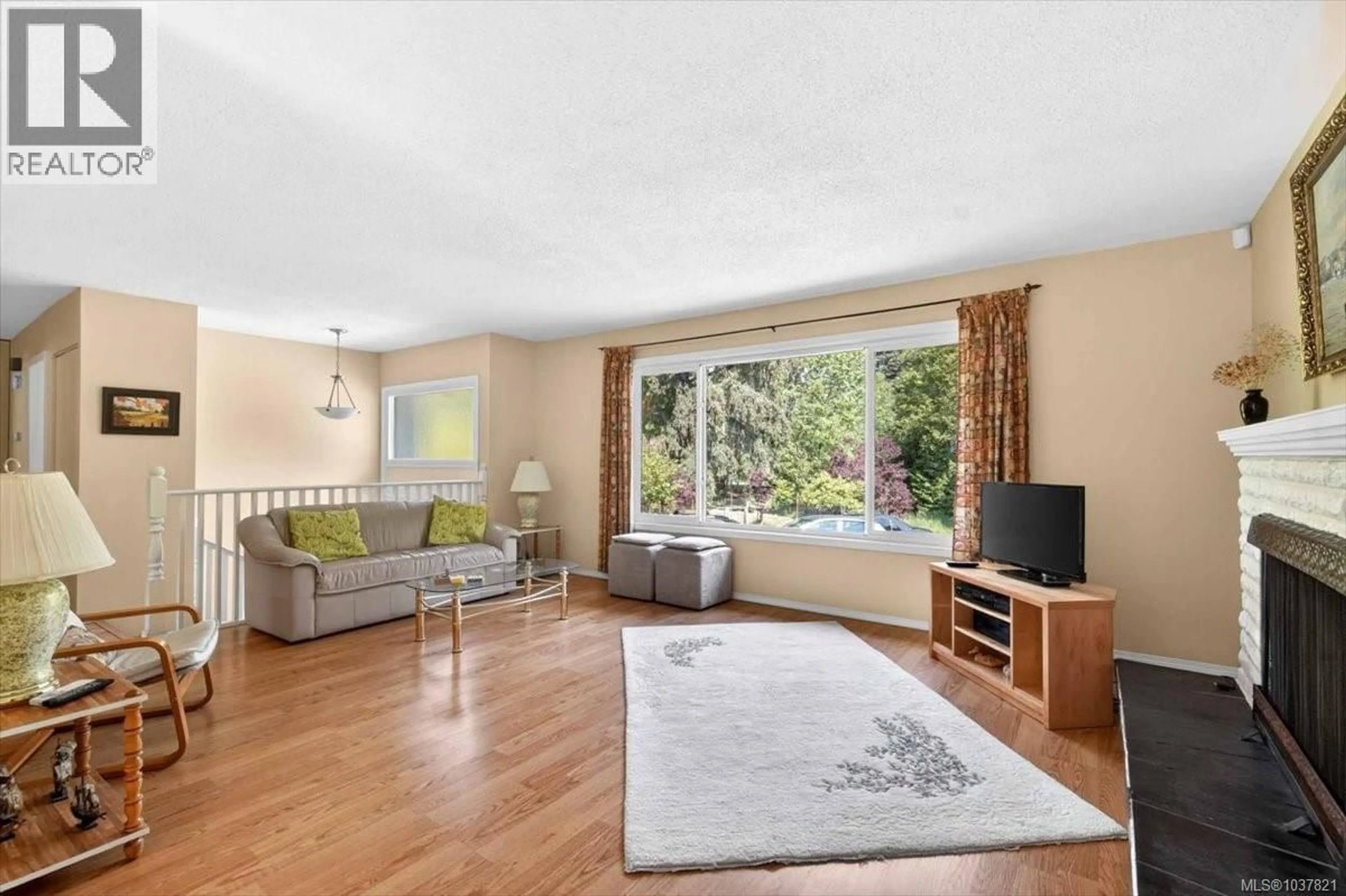 Living room with furniture, wood/laminate floor for 5996 MALABAR ROAD, Port Alberni British Columbia V9Y8L2