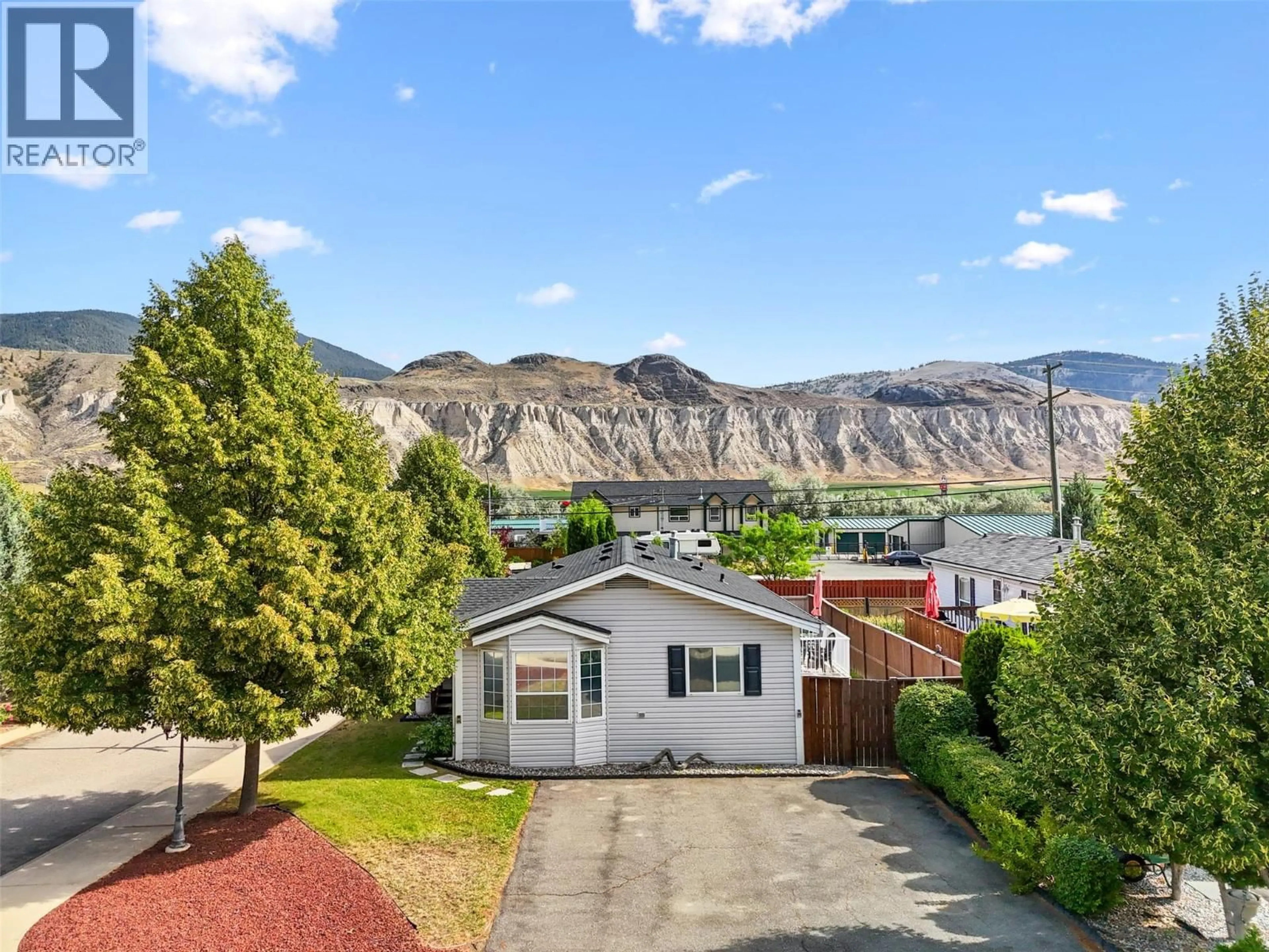 A pic from outside/outdoor area/front of a property/back of a property/a pic from drone, mountain view for 1 - 7545 DALLAS DRIVE, Kamloops British Columbia V2C6X5