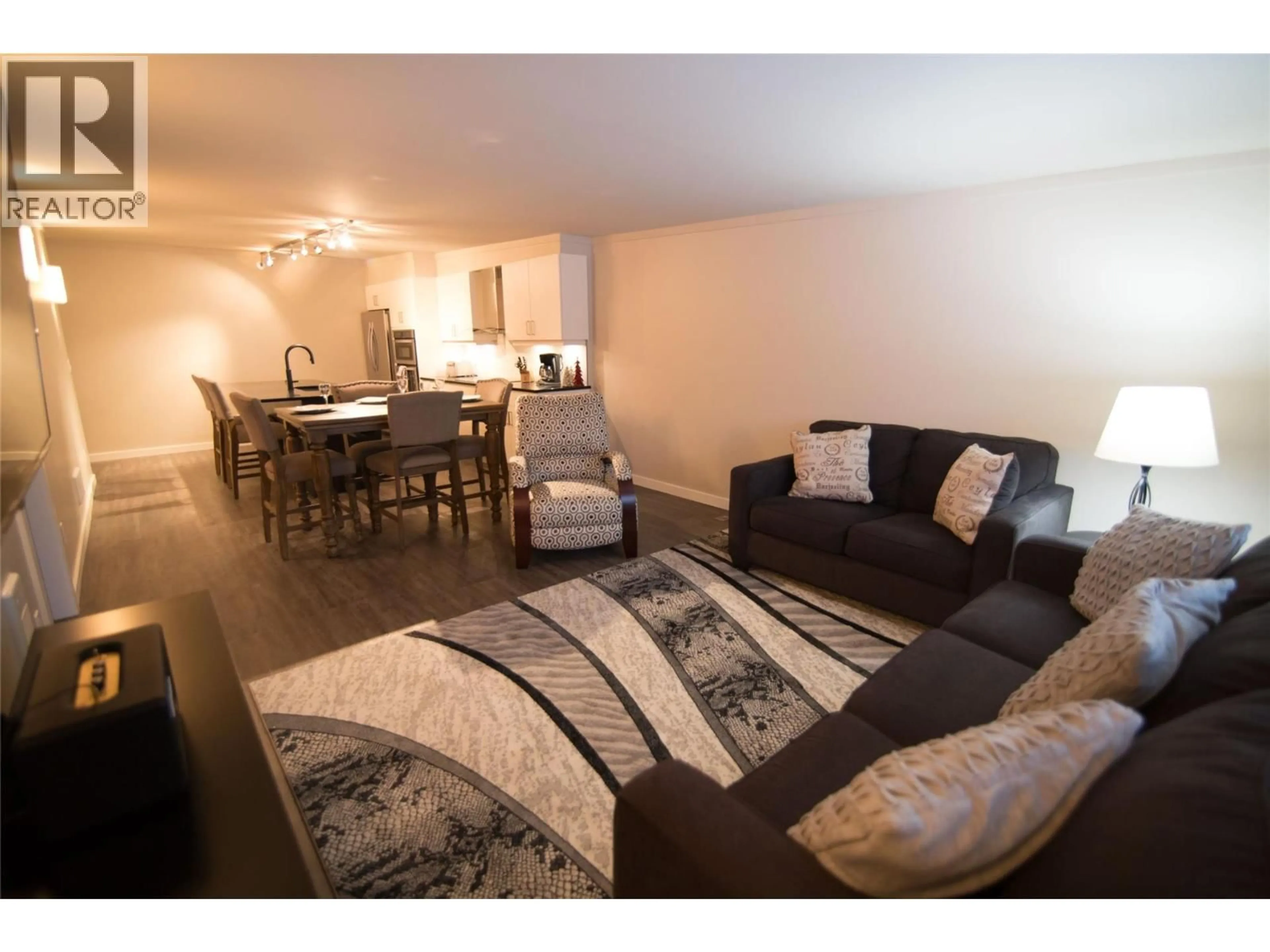 Living room with furniture, wood/laminate floor for 2103B - 1240 POWERHOUSE ROAD, Revelstoke British Columbia V0E2S0