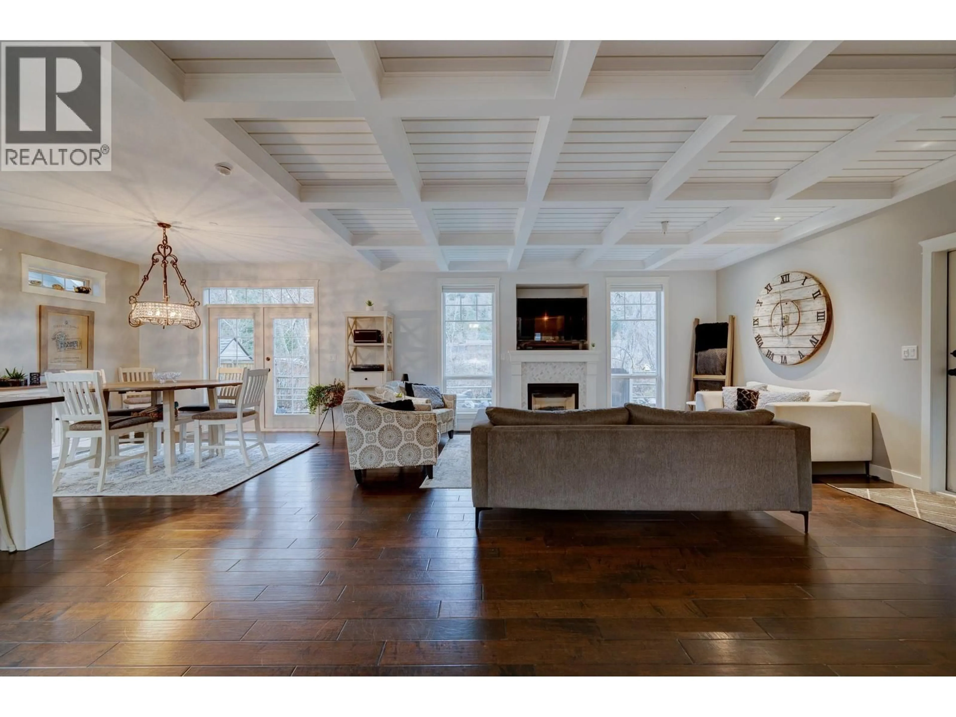 Living room with furniture, wood/laminate floor for 8909 GRIZZLY CRESCENT, Kamloops British Columbia V2C6T9