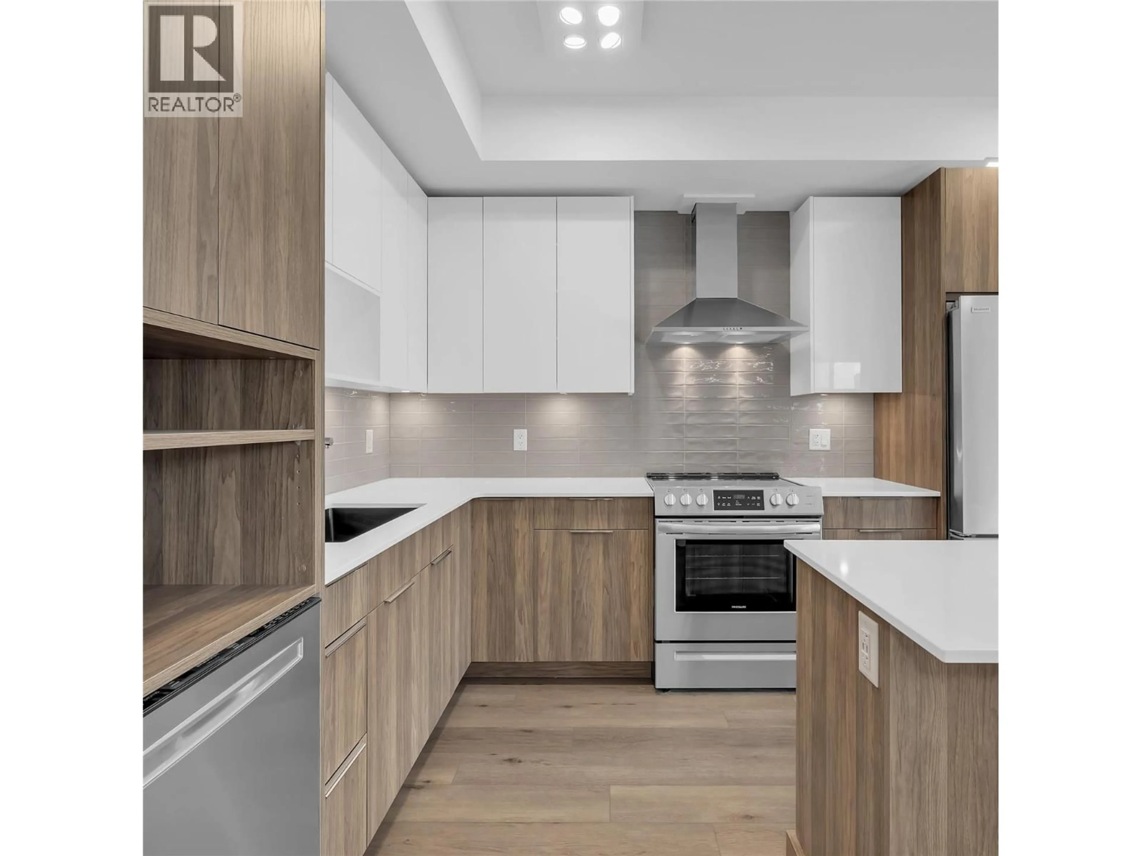 Open concept kitchen, wood/laminate floor for 502C - 3642 MISSION SPRINGS DRIVE, Kelowna British Columbia V1W0E1