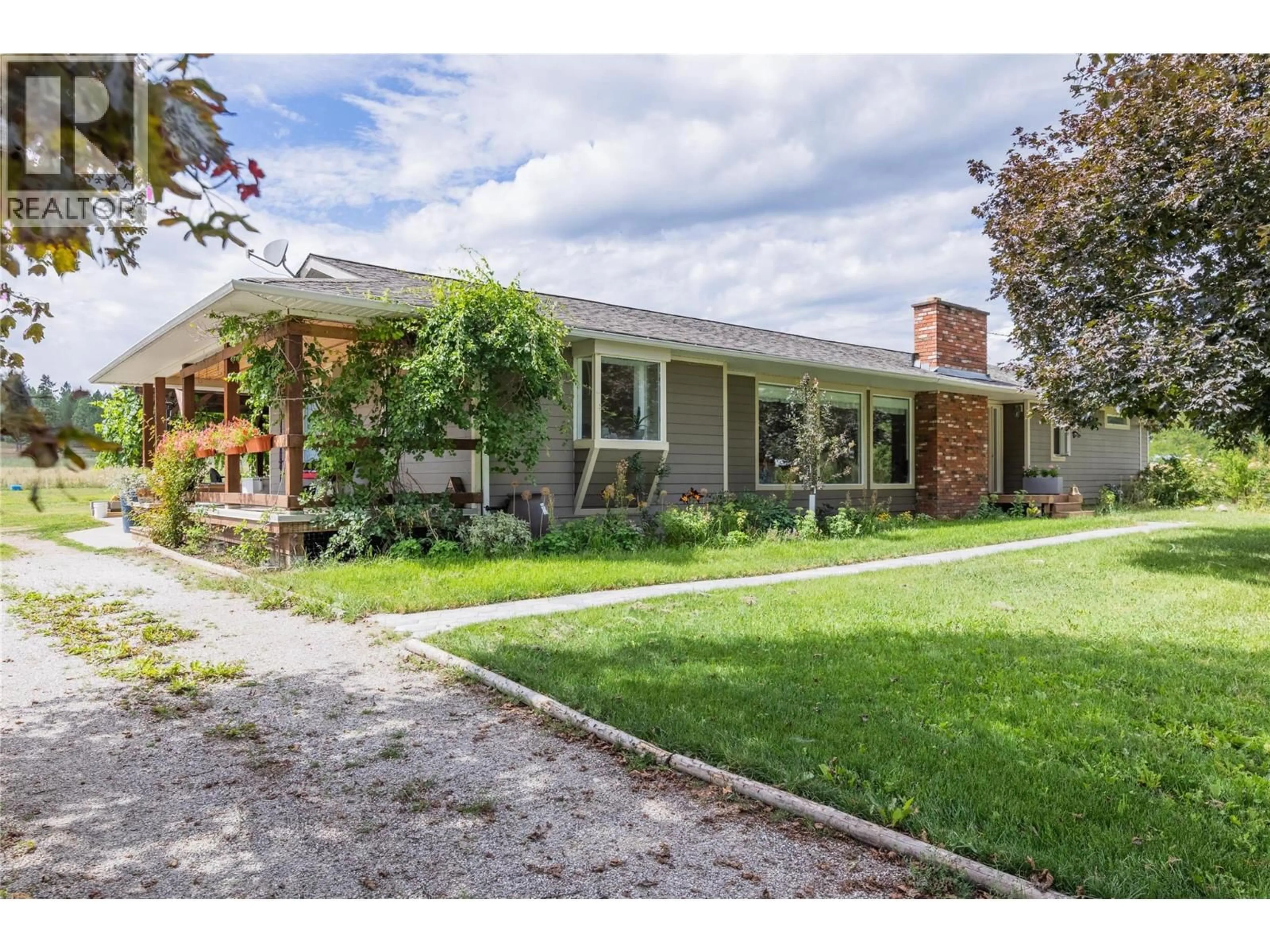 Home with brick exterior material, street for 4780 SLEEPY HOLLOW ROAD, Spallumcheen British Columbia V4Y0T8