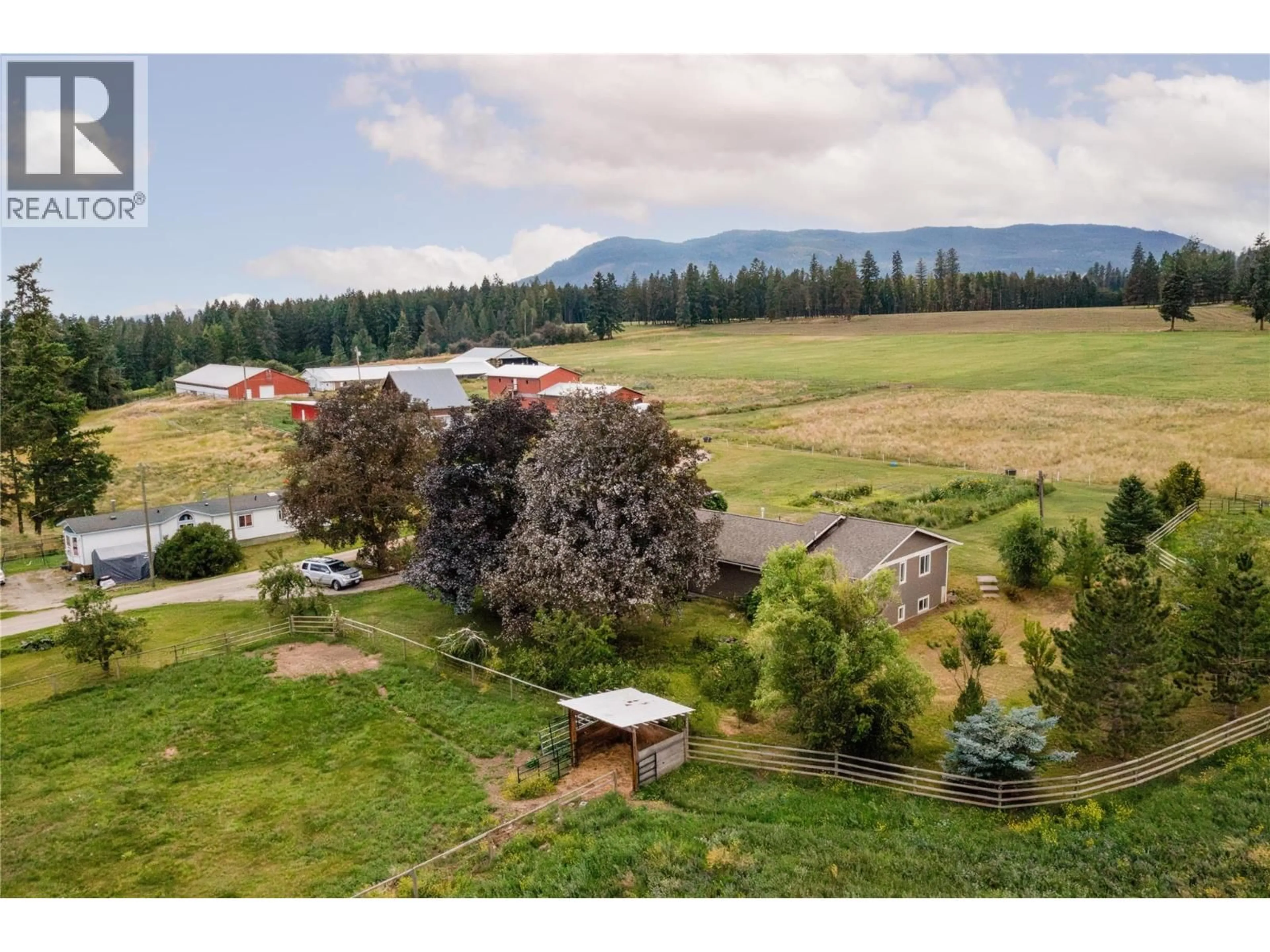 A pic from outside/outdoor area/front of a property/back of a property/a pic from drone, mountain view for 4780 SLEEPY HOLLOW ROAD, Spallumcheen British Columbia V4Y0T8