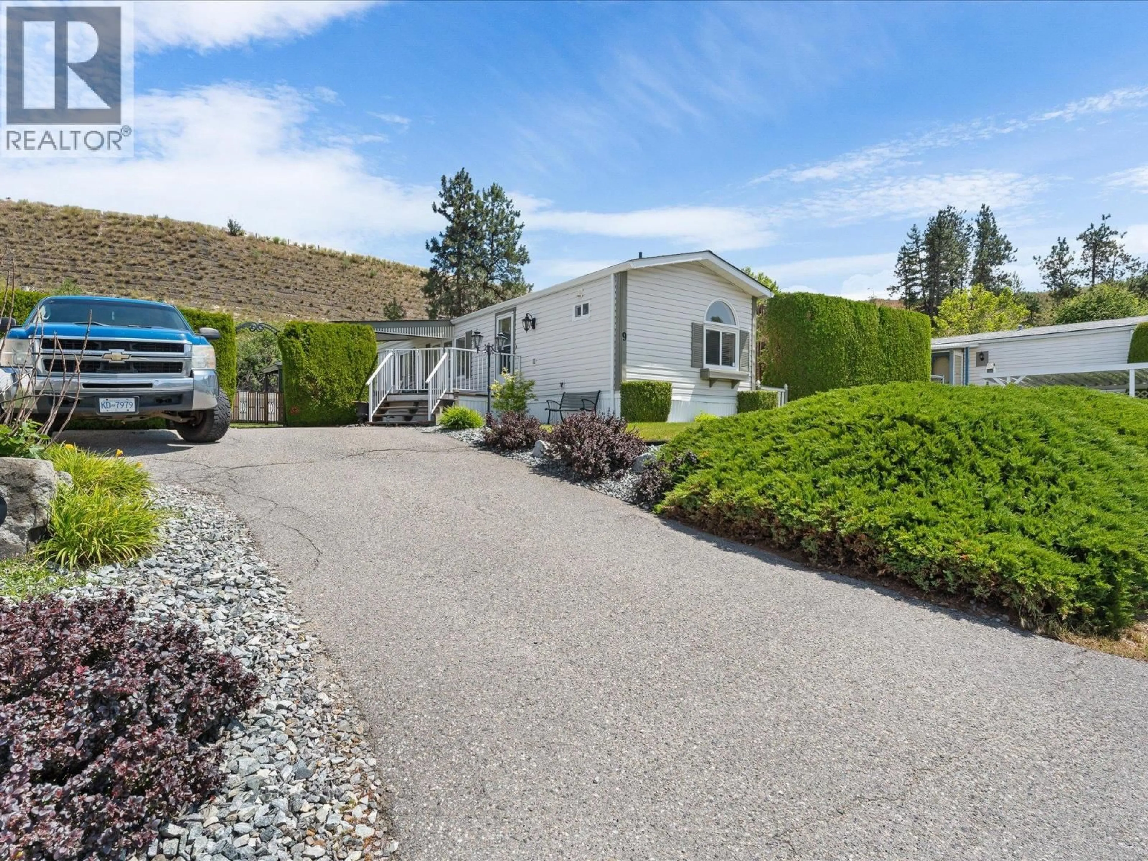 A pic from outside/outdoor area/front of a property/back of a property/a pic from drone, street for 9 - 610 KATHERINE ROAD, West Kelowna British Columbia V1Z3G2