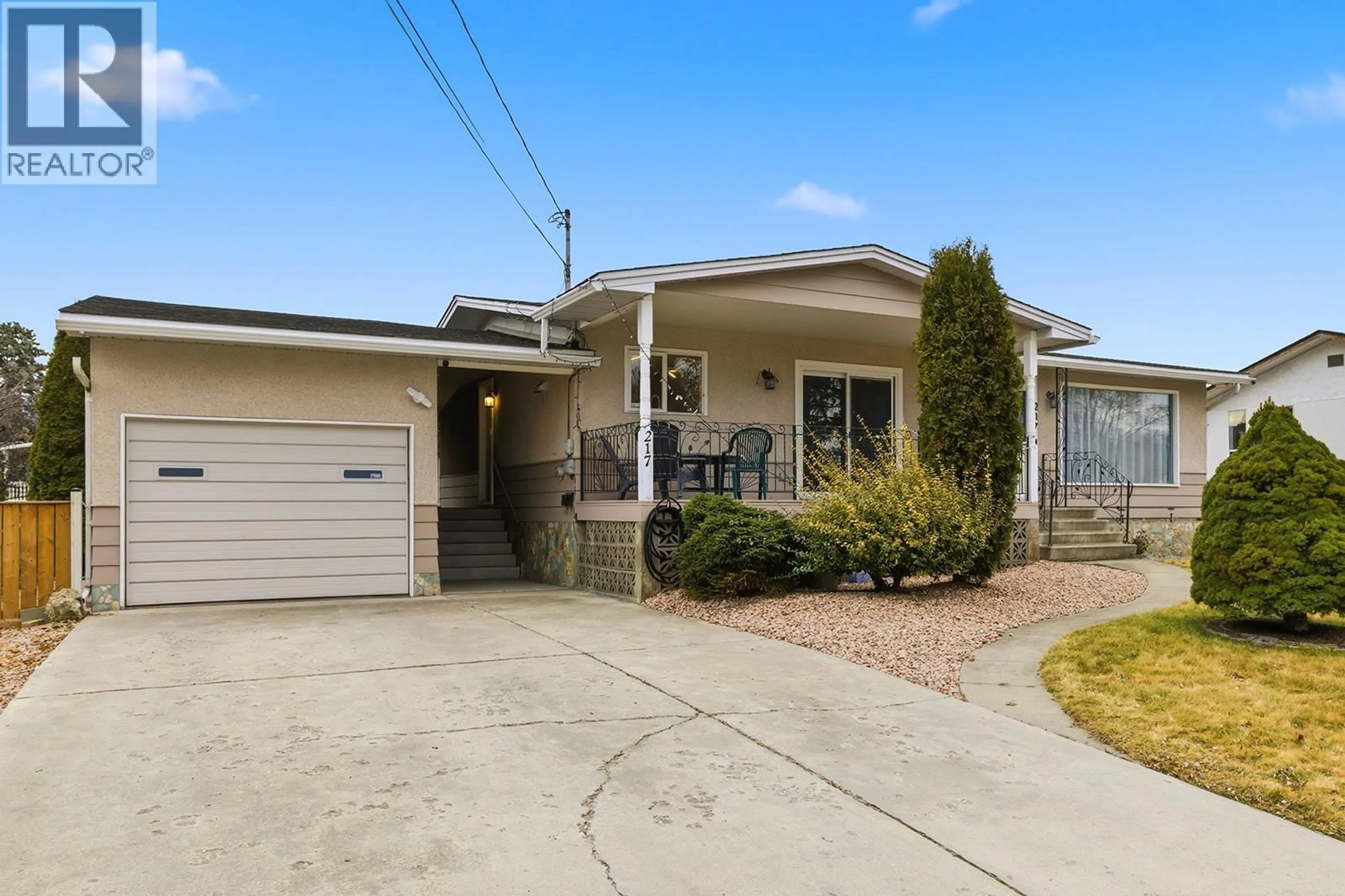 Home with vinyl exterior material, street for 217 HOLBROOK ROAD WEST, Kelowna British Columbia V1X1S1