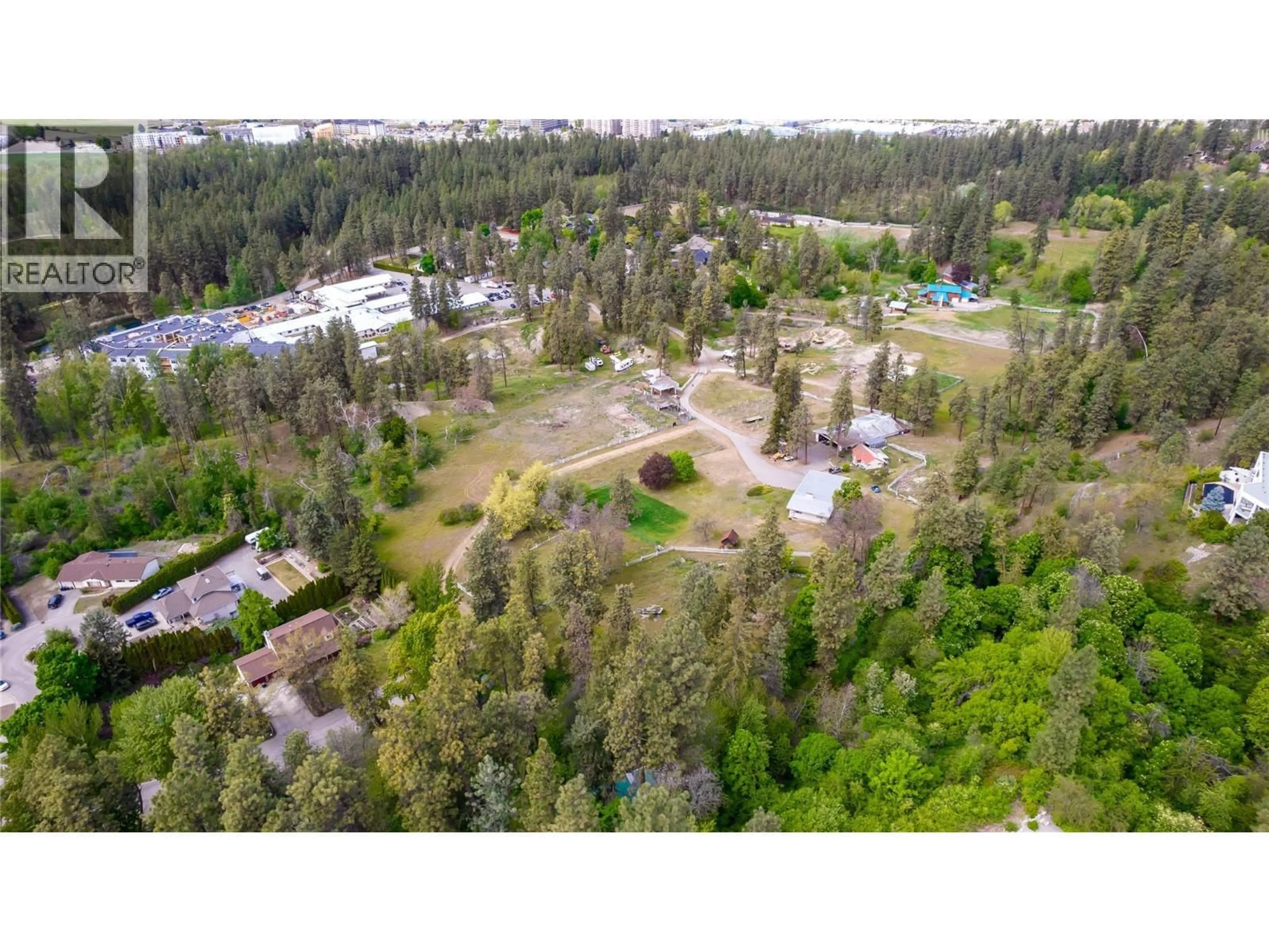 A pic from outside/outdoor area/front of a property/back of a property/a pic from drone, forest/trees view for 2718 O'REILLY ROAD, Kelowna British Columbia V1W2R5