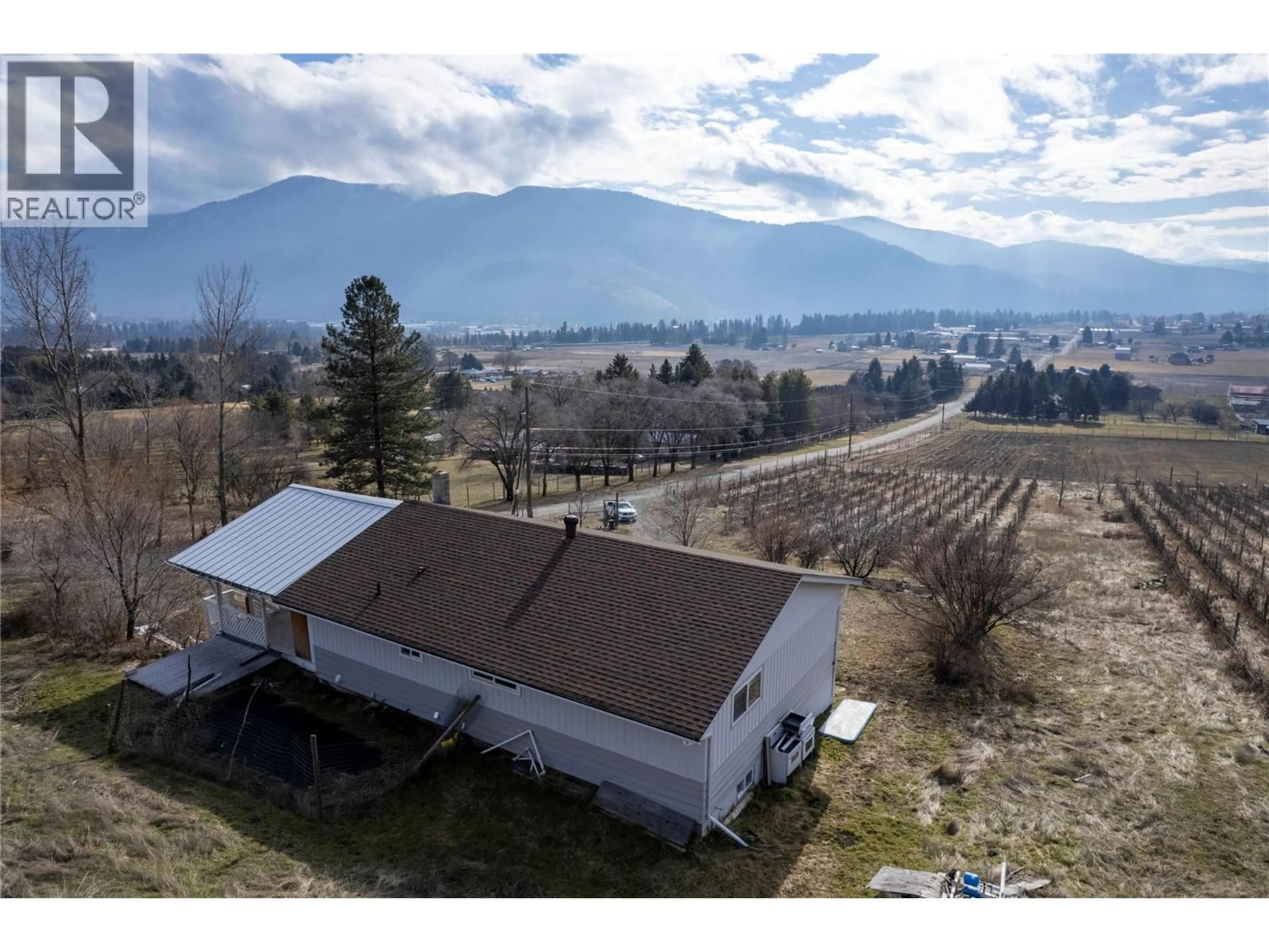 A pic from outside/outdoor area/front of a property/back of a property/a pic from drone, mountain view for 6805 RESERVOIR ROAD, Grand Forks British Columbia V0H1H5