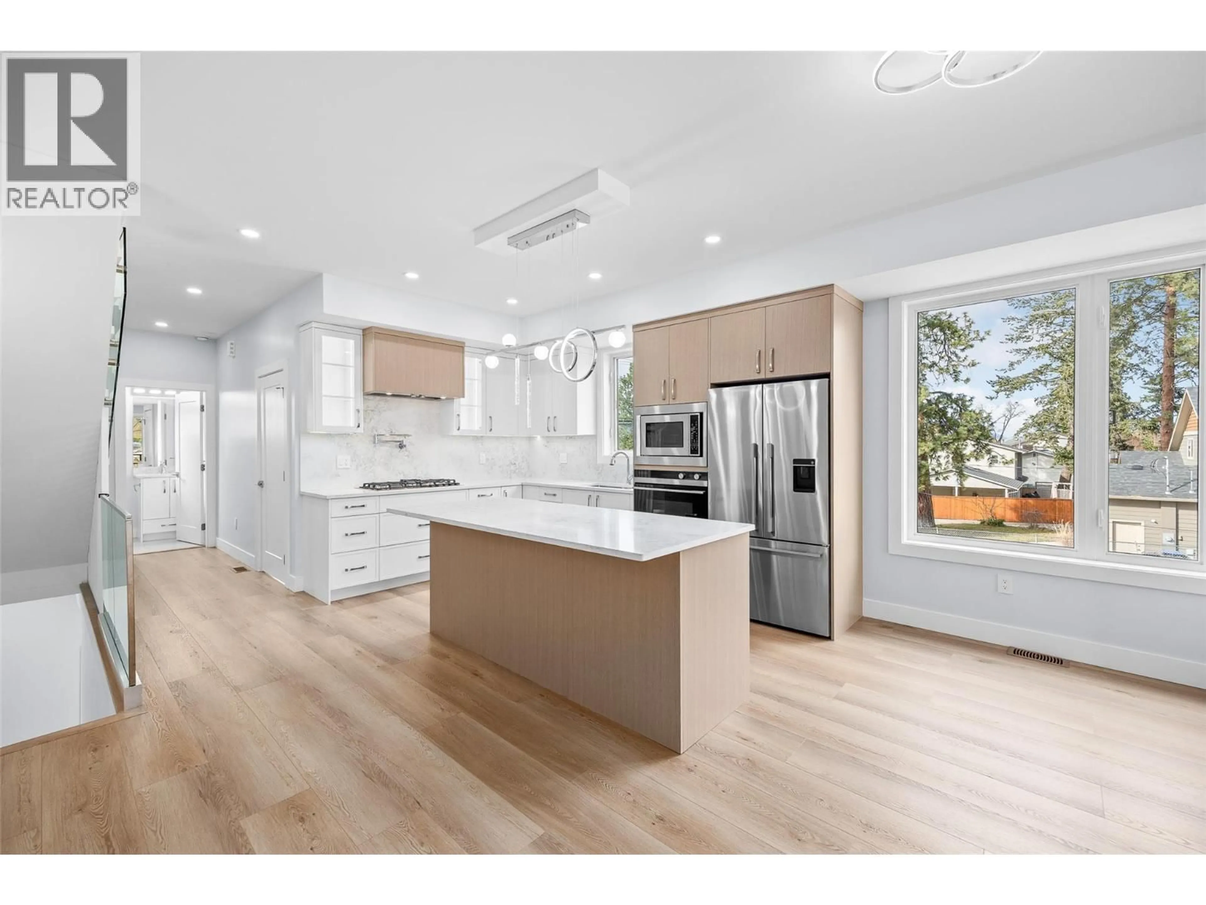 Open concept kitchen, wood/laminate floor for 4563 GORDON DRIVE, Kelowna British Columbia V1W1T3