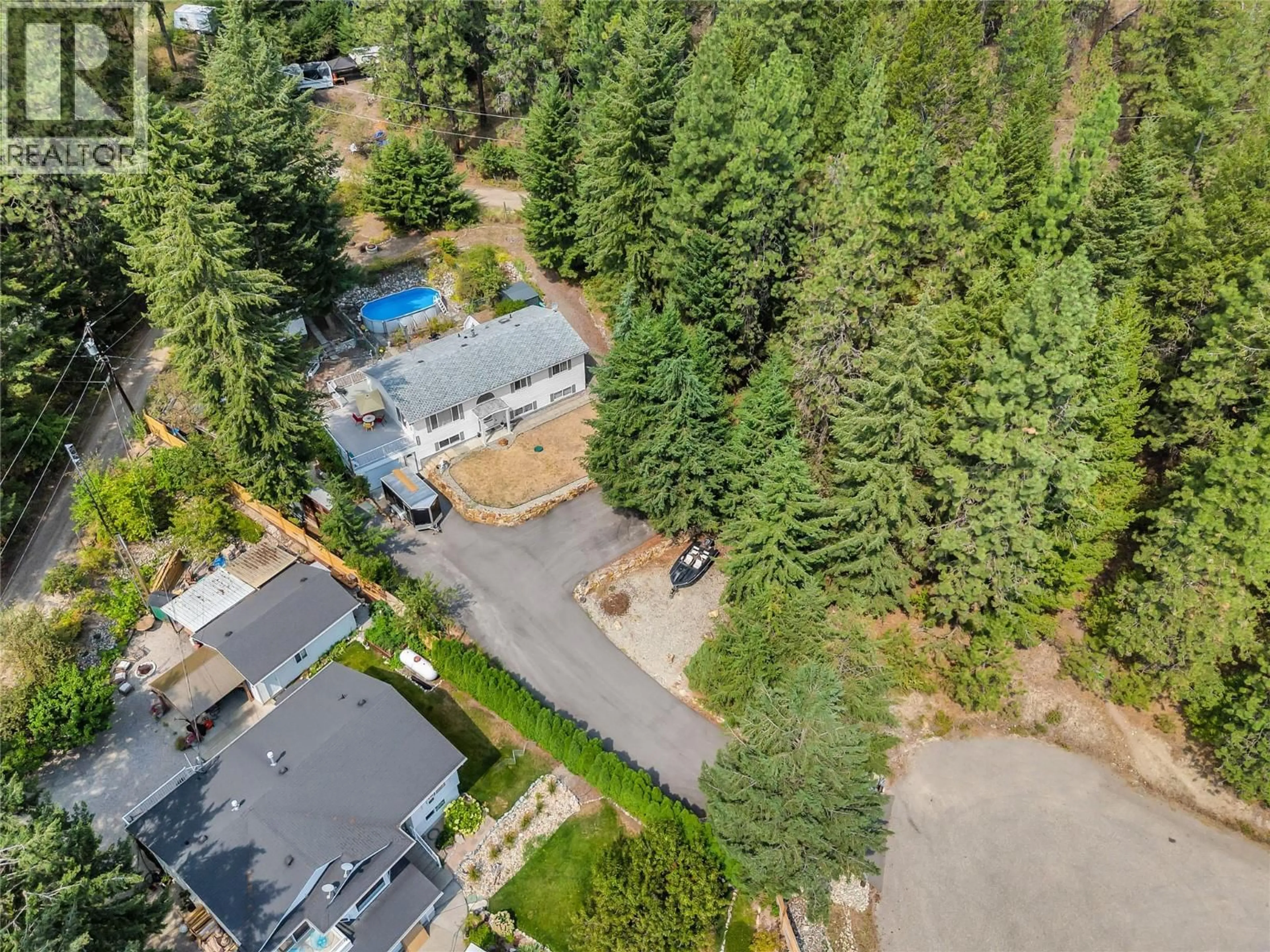 A pic from outside/outdoor area/front of a property/back of a property/a pic from drone, forest/trees view for 10736 PINECREST ROAD, Vernon British Columbia V1H2C1