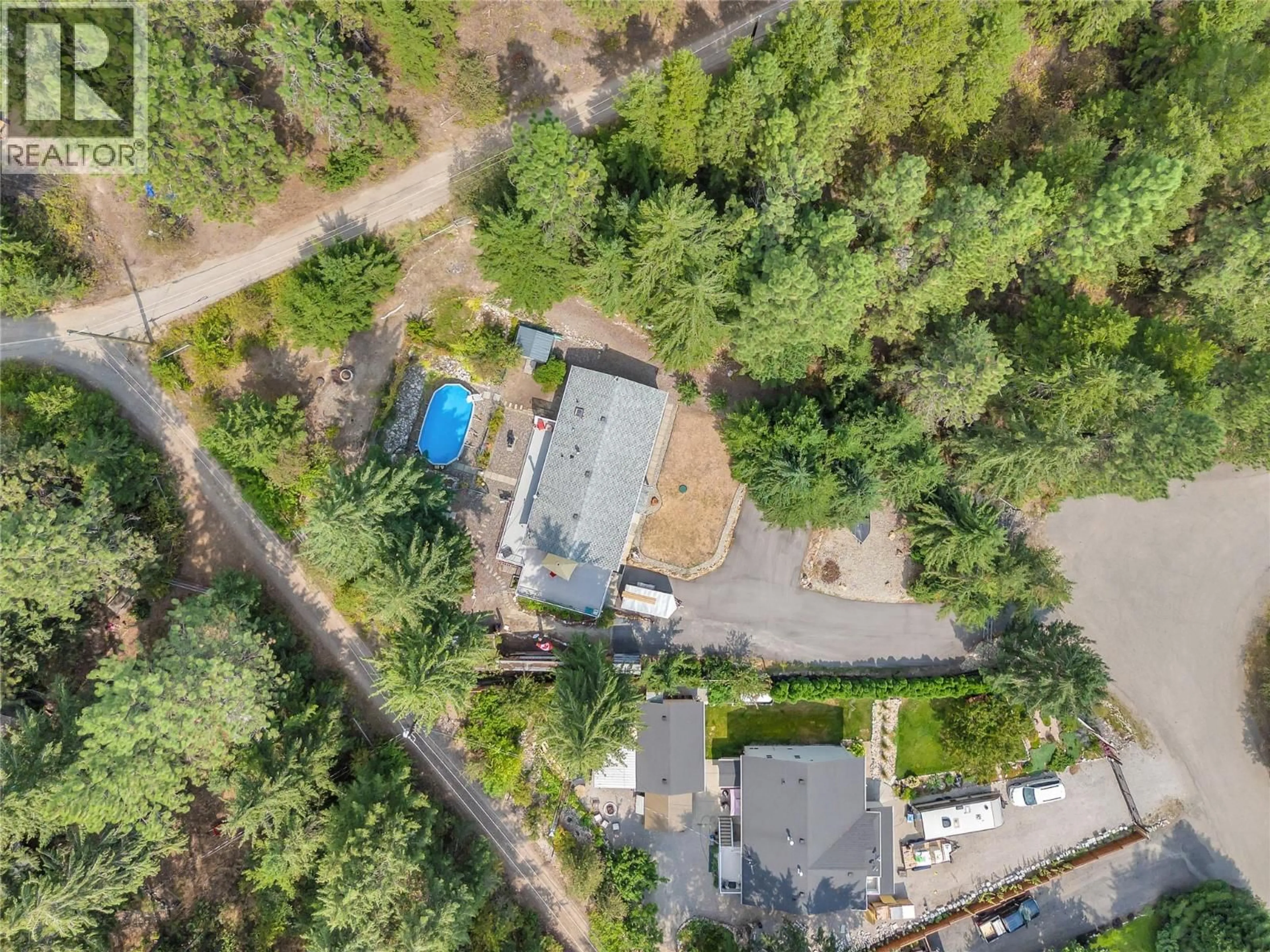 A pic from outside/outdoor area/front of a property/back of a property/a pic from drone, unknown for 10736 PINECREST ROAD, Vernon British Columbia V1H2C1