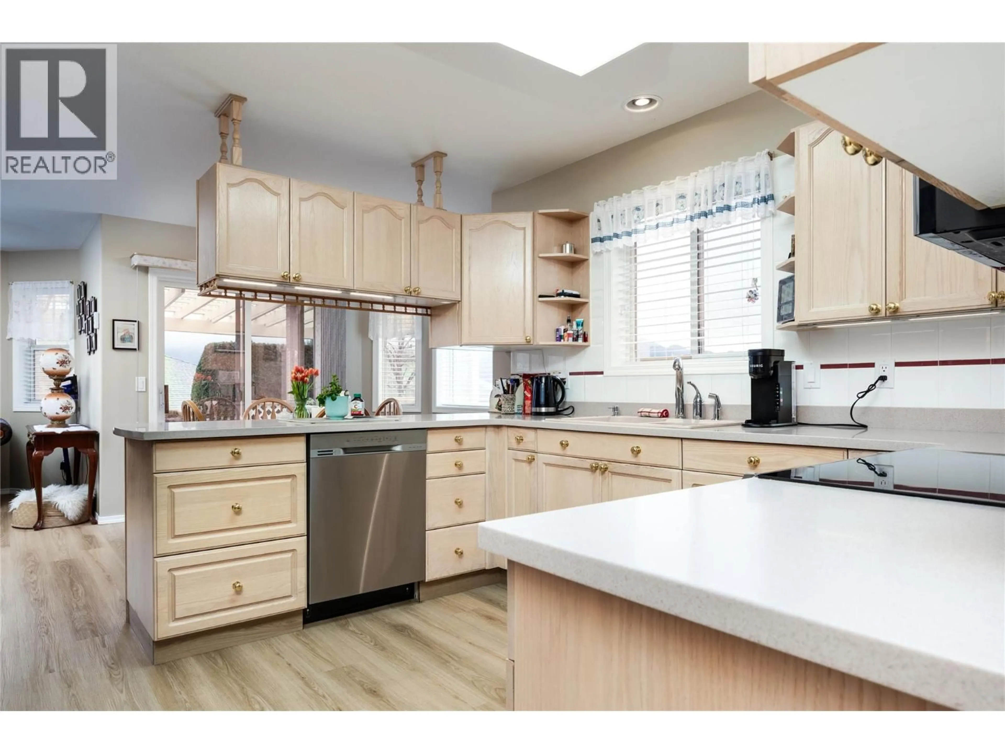 Open concept kitchen, wood/laminate floor for 128 - 2250 LOUIE DRIVE, Westbank British Columbia V4T2M6