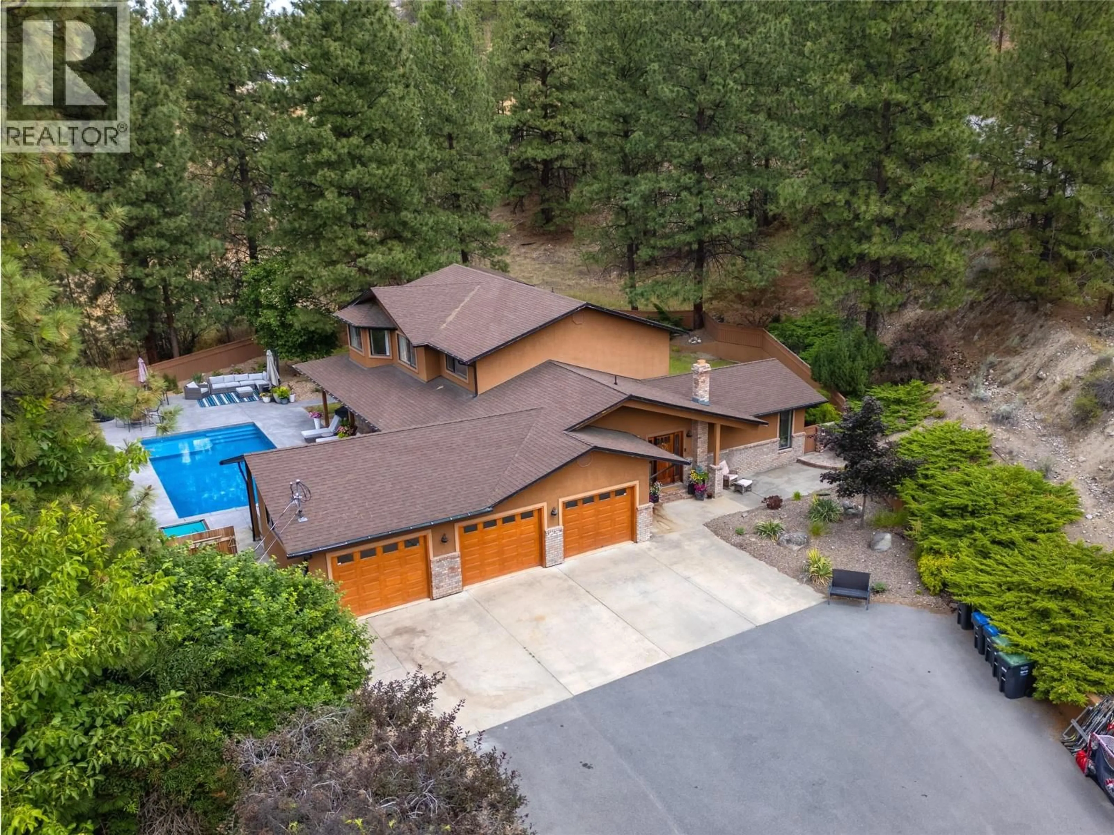 A pic from outside/outdoor area/front of a property/back of a property/a pic from drone, unknown for 3948 VALLEYVIEW ROAD, Penticton British Columbia V2A8V8