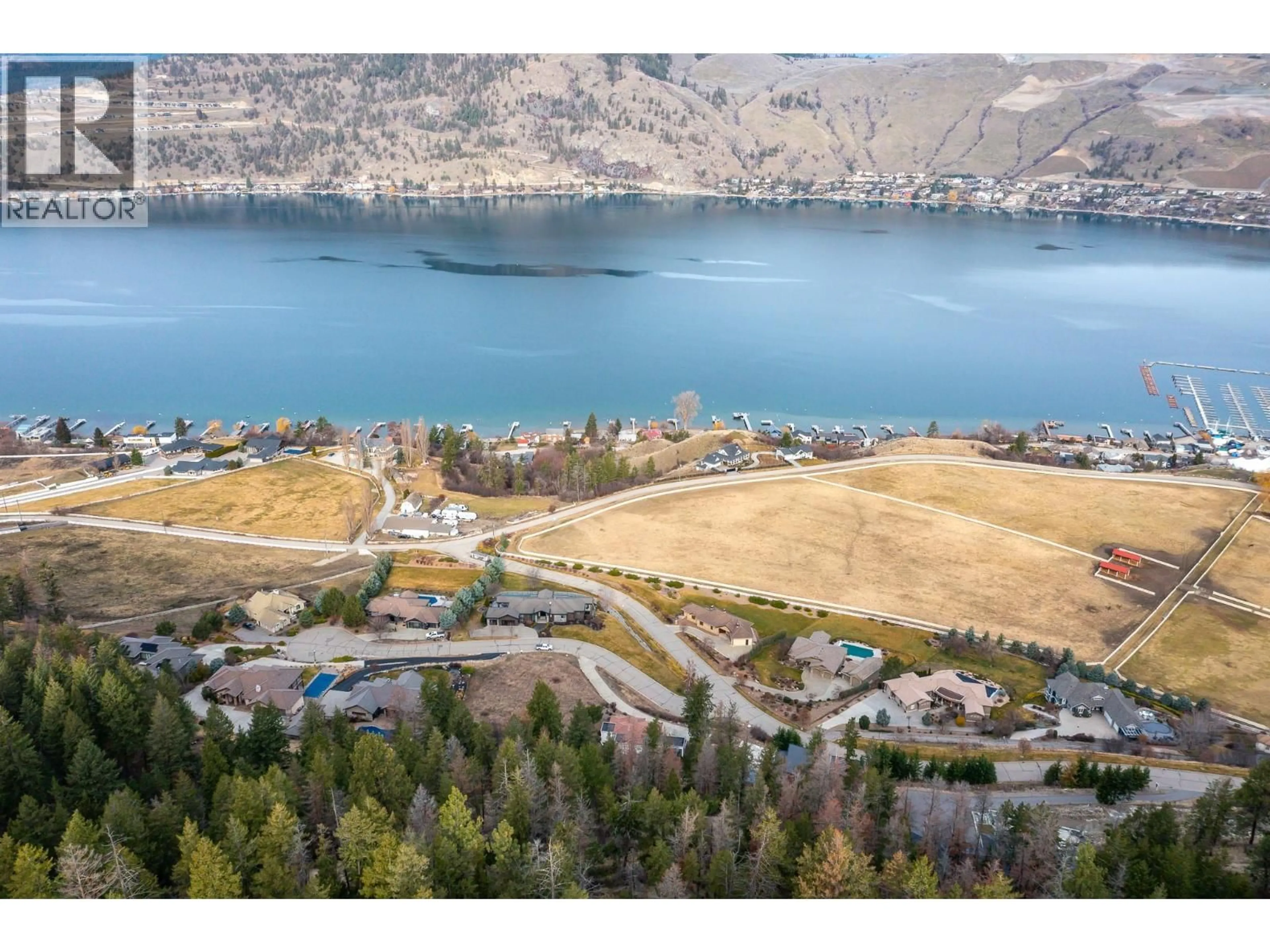 A pic from outside/outdoor area/front of a property/back of a property/a pic from drone, water/lake/river/ocean view for 200 MELROSE COURT, Vernon British Columbia V1H1T7