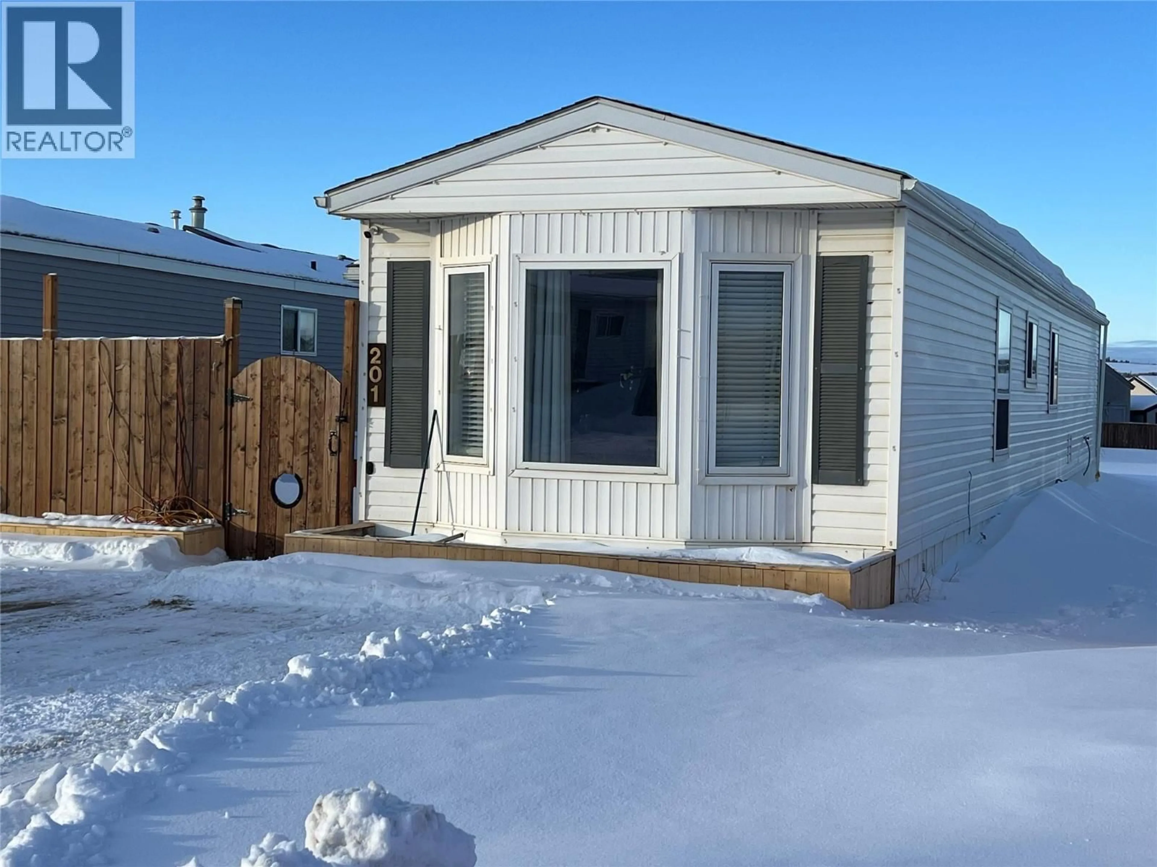 Home with vinyl exterior material, street for 201 - 1200 ADAMS ROAD, Dawson Creek British Columbia V1G5A2