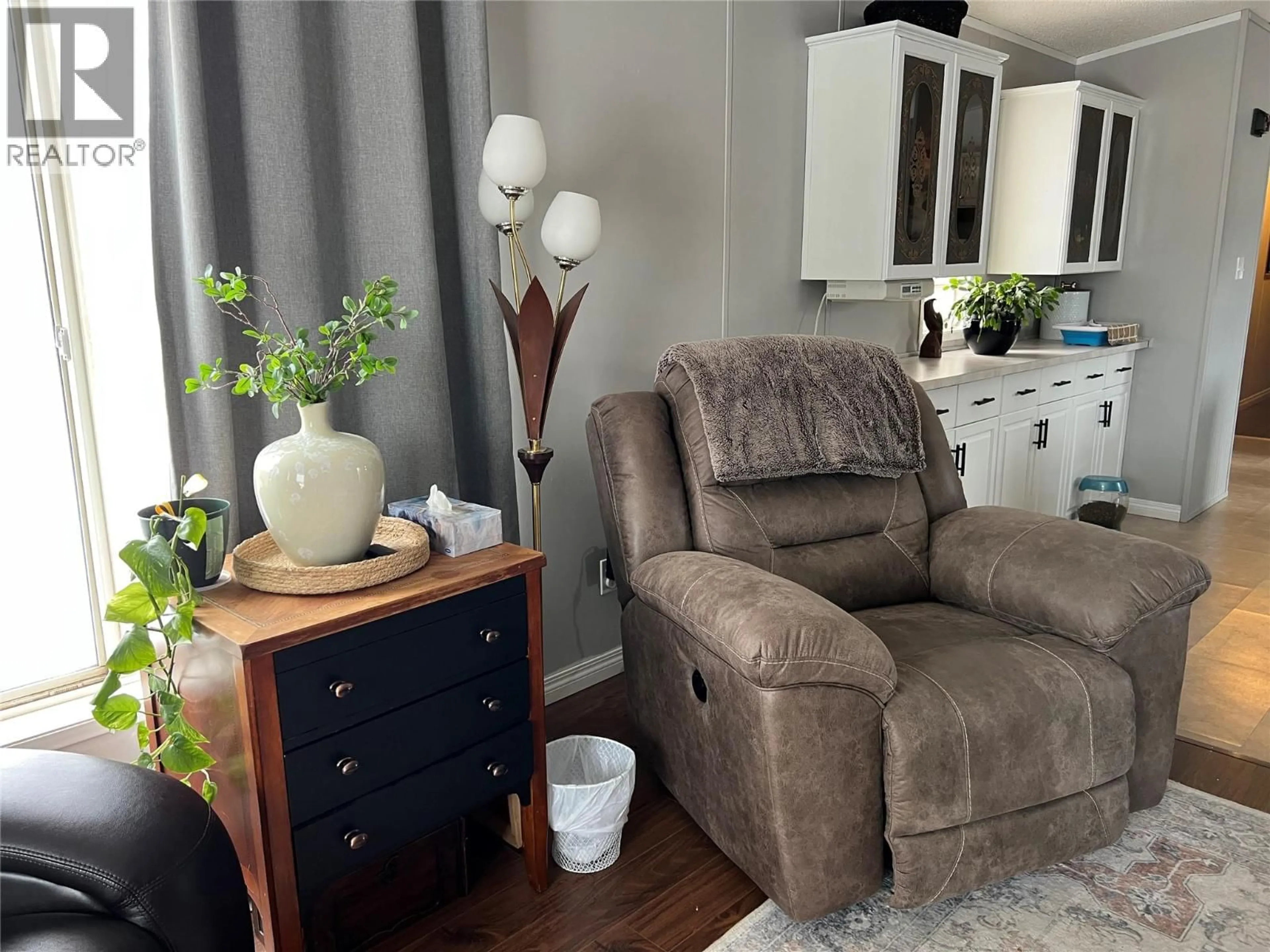 Living room with furniture, wood/laminate floor for 201 - 1200 ADAMS ROAD, Dawson Creek British Columbia V1G5A2