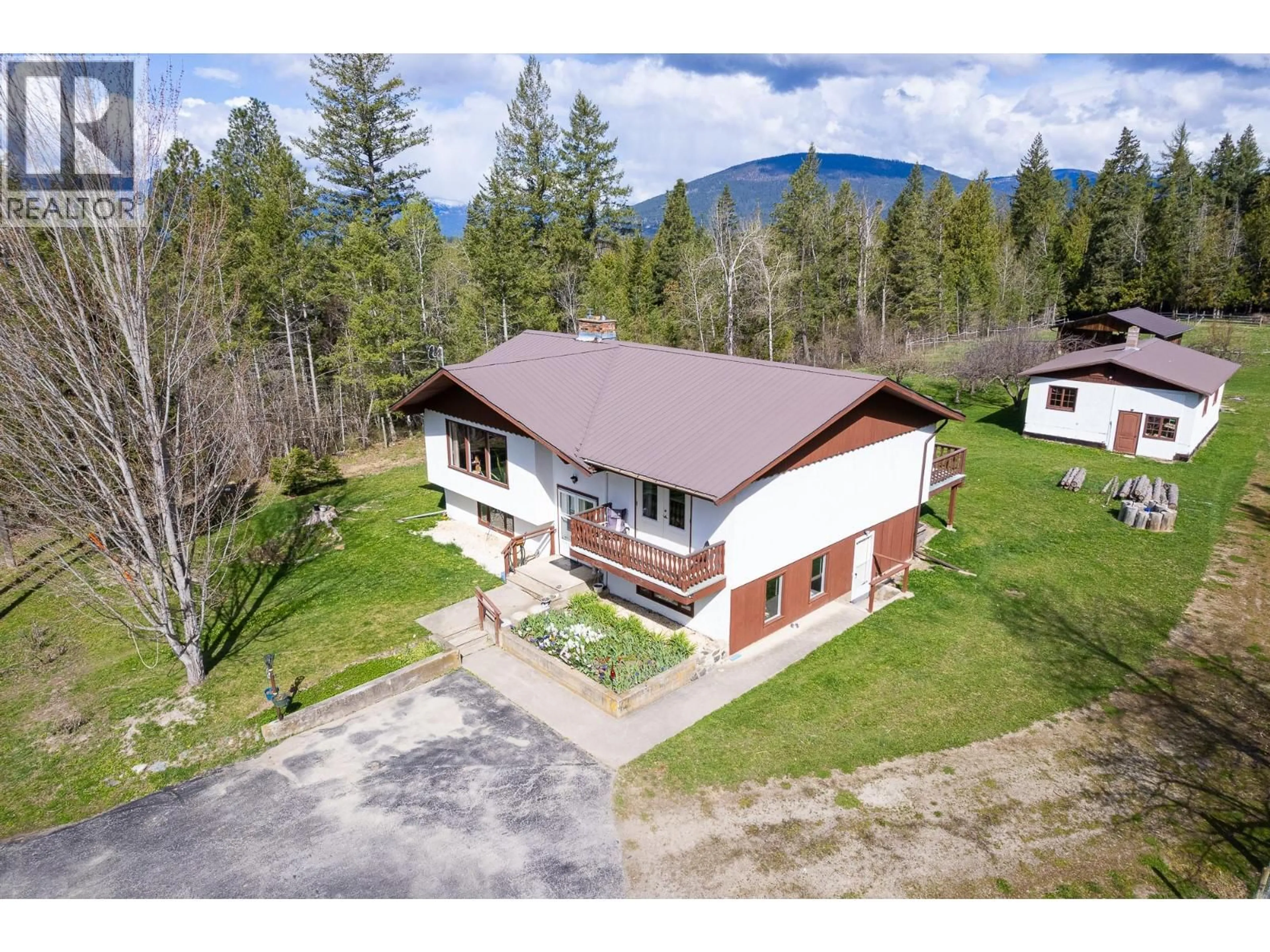 A pic from outside/outdoor area/front of a property/back of a property/a pic from drone, mountain view for 4856 32ND STREET, Canyon British Columbia V0B1C1
