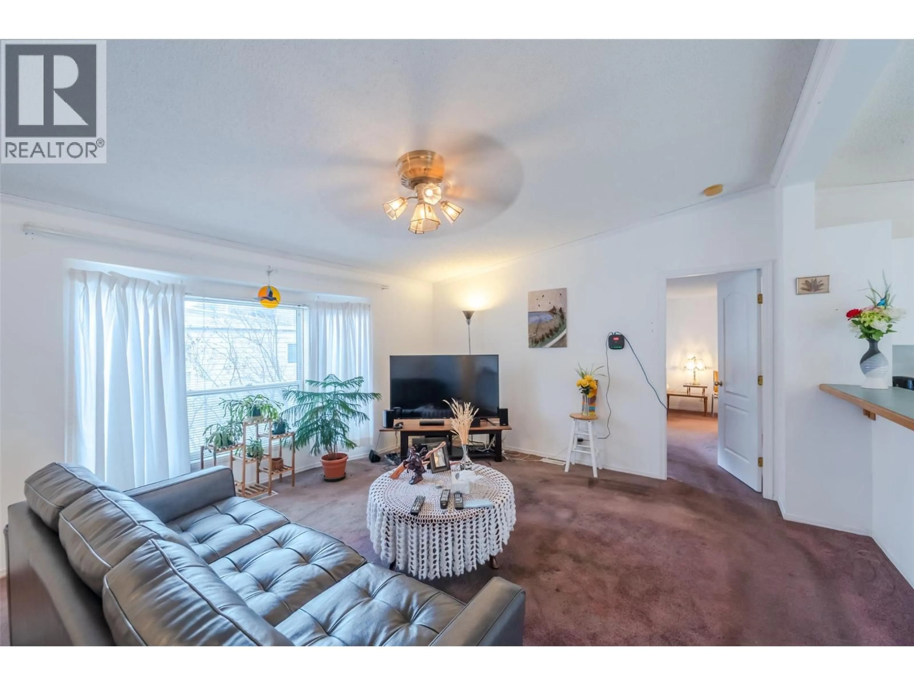 Living room with furniture, unknown for E12 - 4505 MCLEAN CREEK ROAD, Okanagan Falls British Columbia V0H1R1