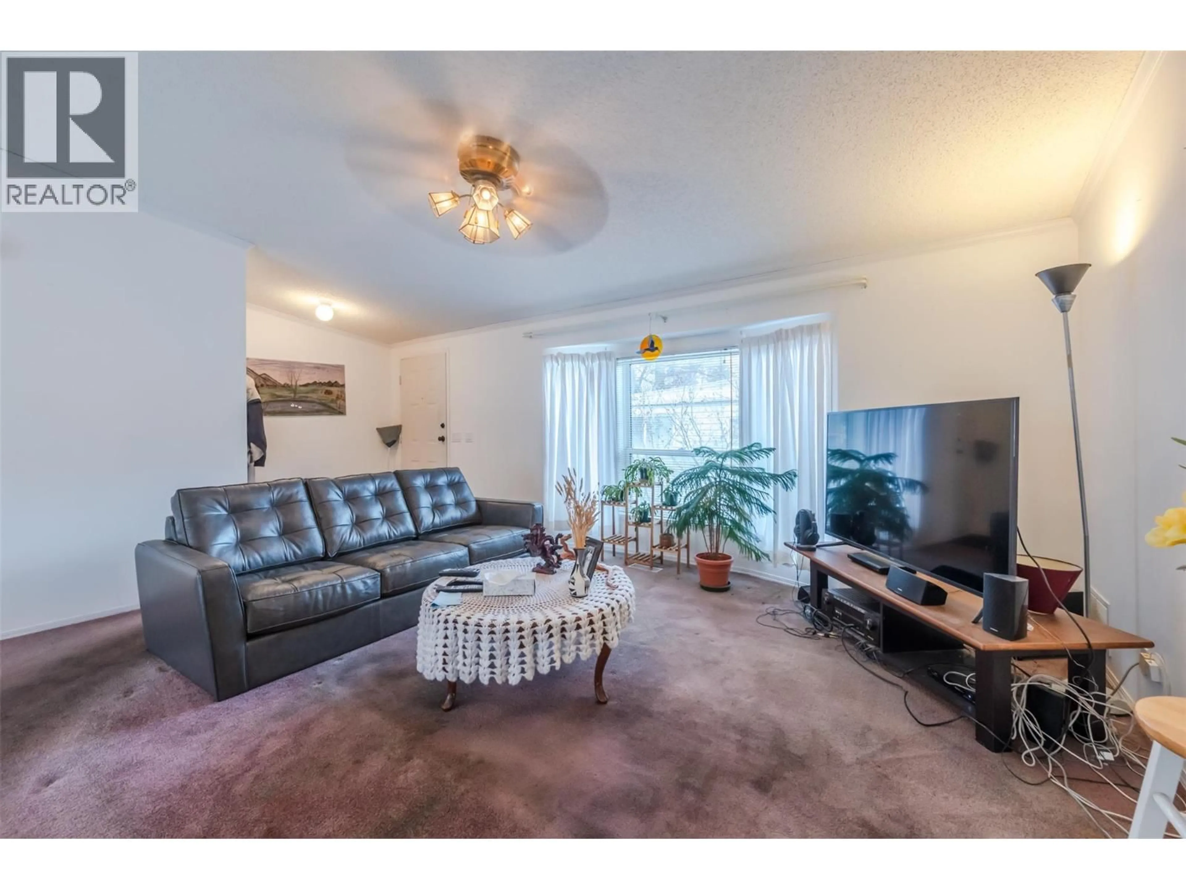 Living room with furniture, unknown for E12 - 4505 MCLEAN CREEK ROAD, Okanagan Falls British Columbia V0H1R1