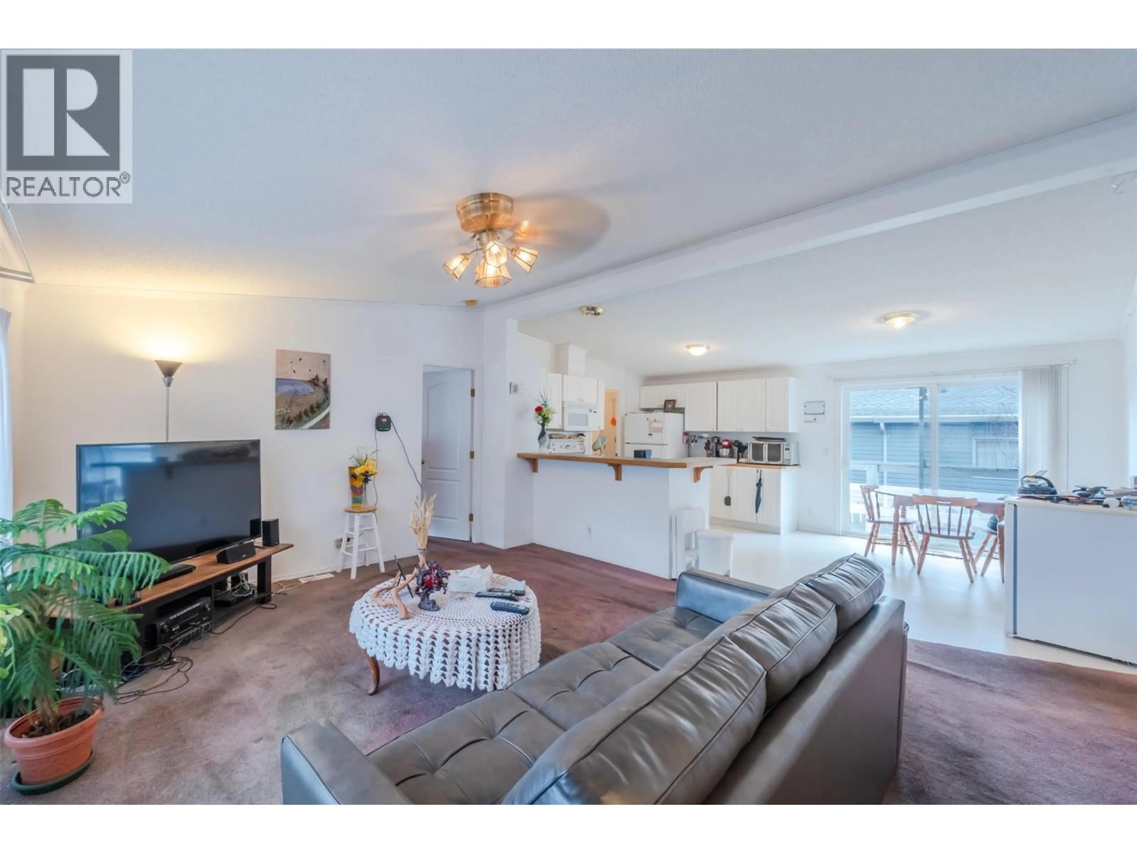 Living room with furniture, unknown for E12 - 4505 MCLEAN CREEK ROAD, Okanagan Falls British Columbia V0H1R1