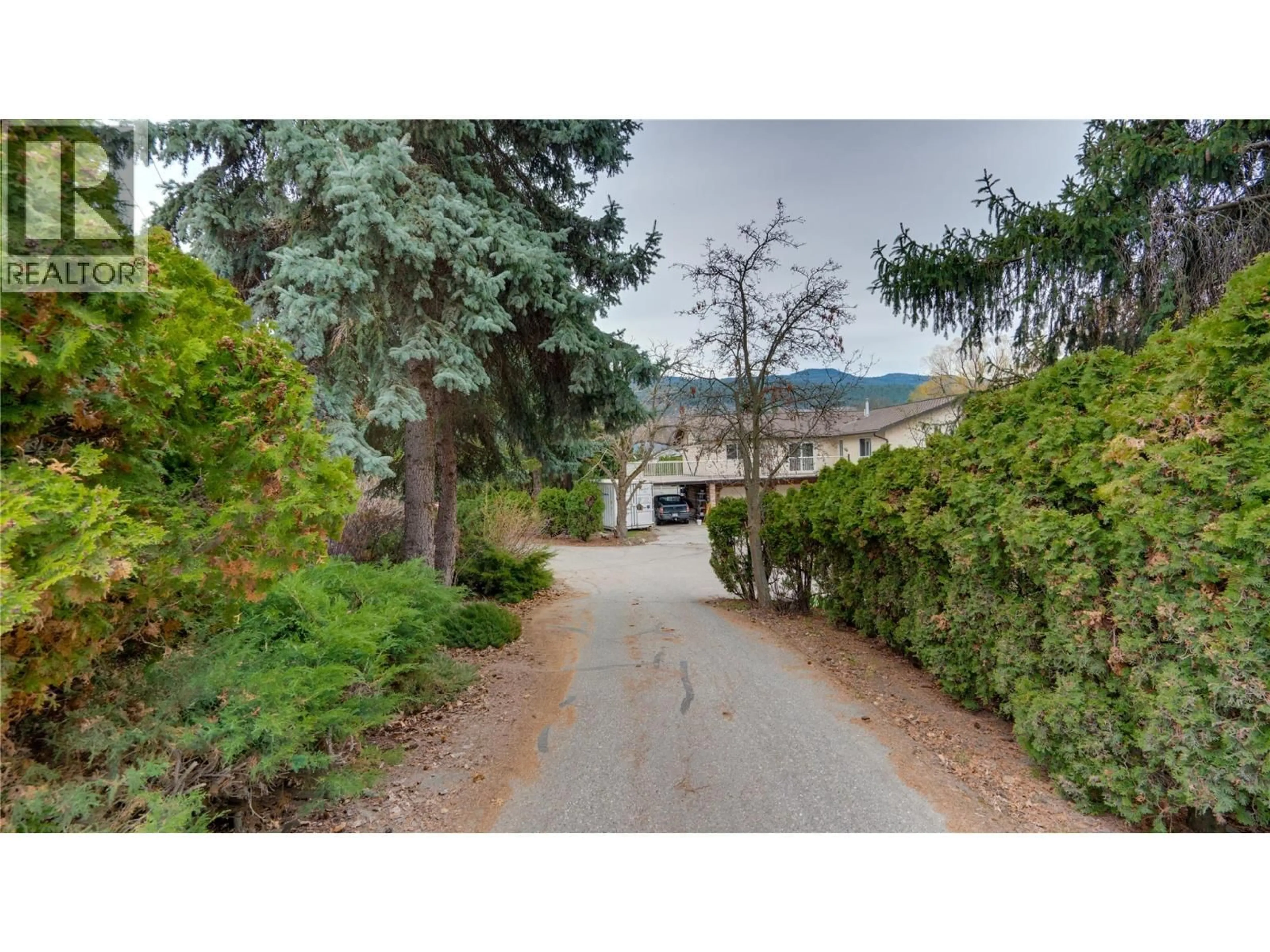 A pic from outside/outdoor area/front of a property/back of a property/a pic from drone, street for 12300 KALAMALKA ROAD, Coldstream British Columbia V1B1M6