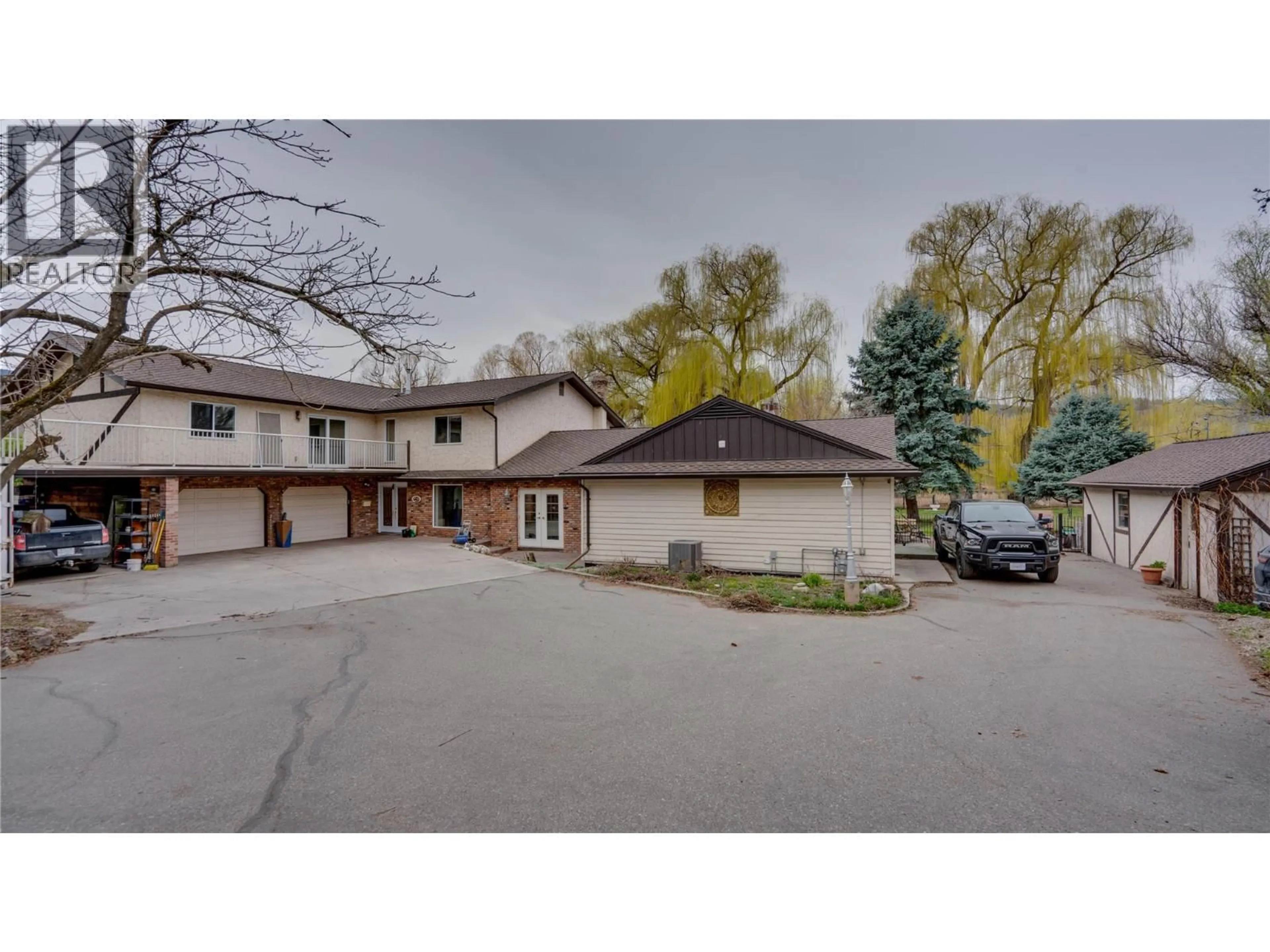 A pic from outside/outdoor area/front of a property/back of a property/a pic from drone, street for 12300 KALAMALKA ROAD, Coldstream British Columbia V1B1M6