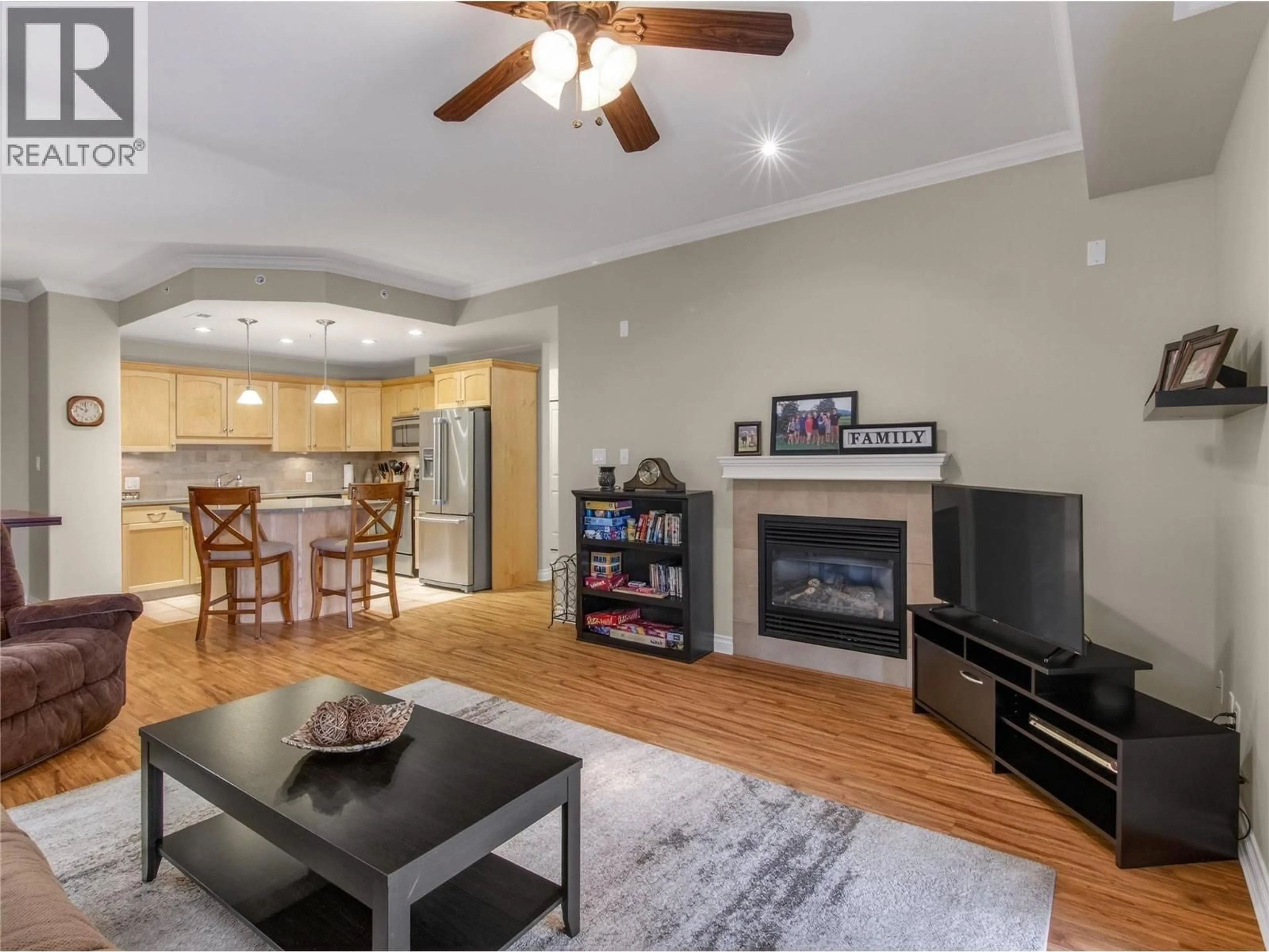 Living room with furniture, wood/laminate floor for 103 - 277 YORKTON AVENUE, Penticton British Columbia V2A3V4