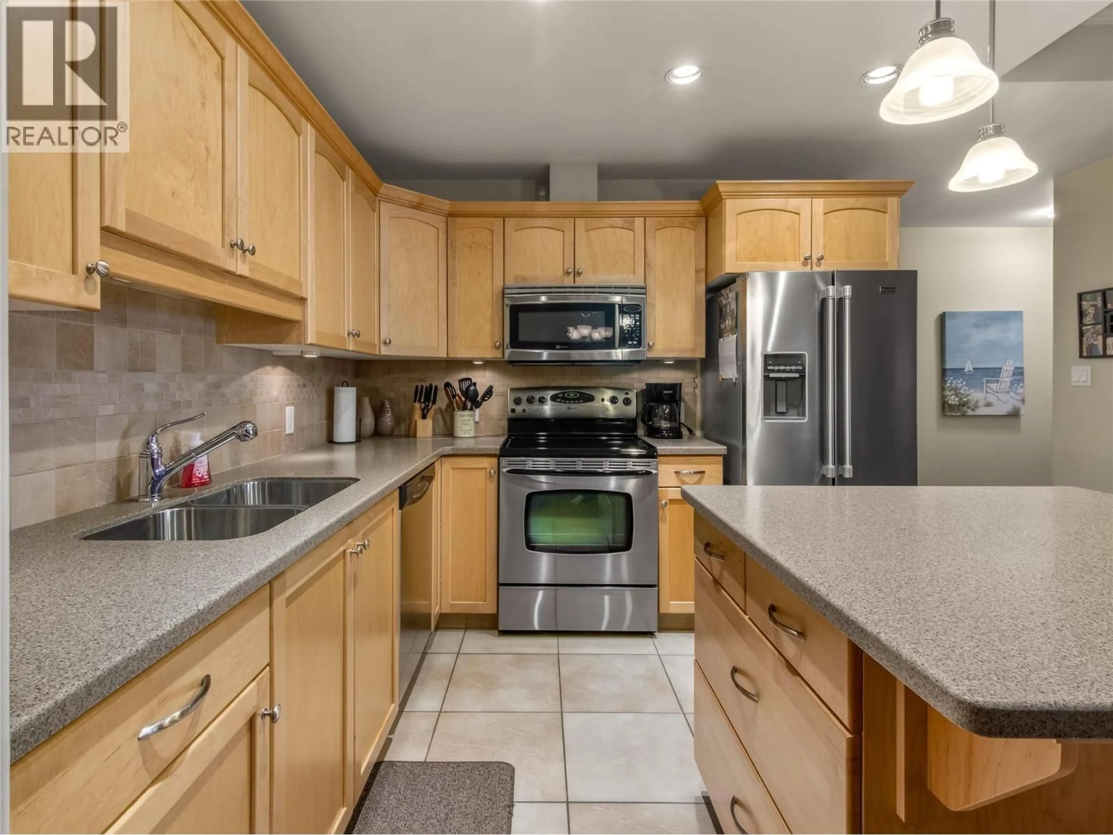 Open concept kitchen, ceramic/tile floor for 103 - 277 YORKTON AVENUE, Penticton British Columbia V2A3V4