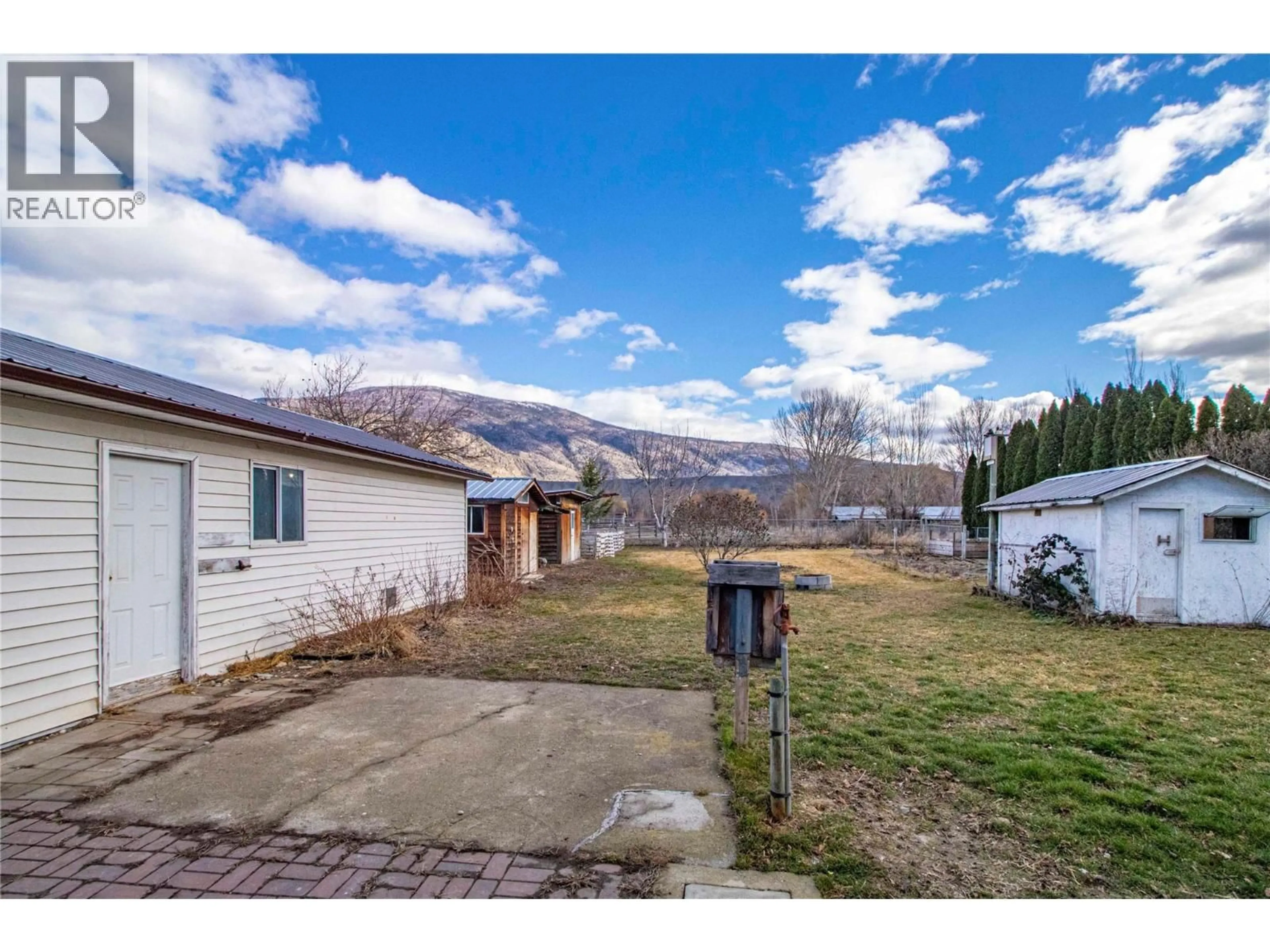 A pic from outside/outdoor area/front of a property/back of a property/a pic from drone, mountain view for 7171 ISLAND WAY ROAD, Oliver British Columbia V0H1T7