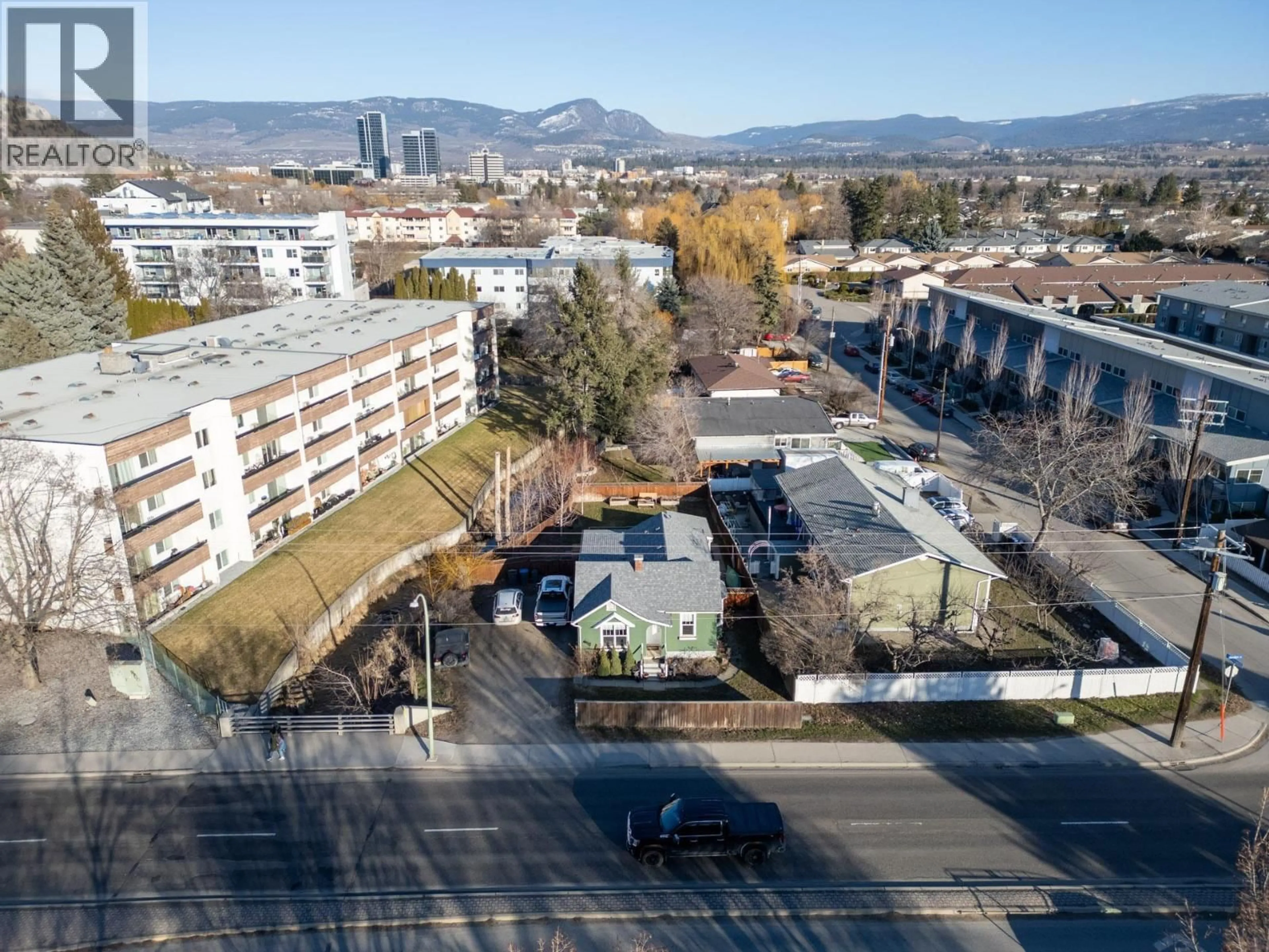 A pic from outside/outdoor area/front of a property/back of a property/a pic from drone, mountain view for 1981 GORDON DRIVE, Kelowna British Columbia V1Y3J1