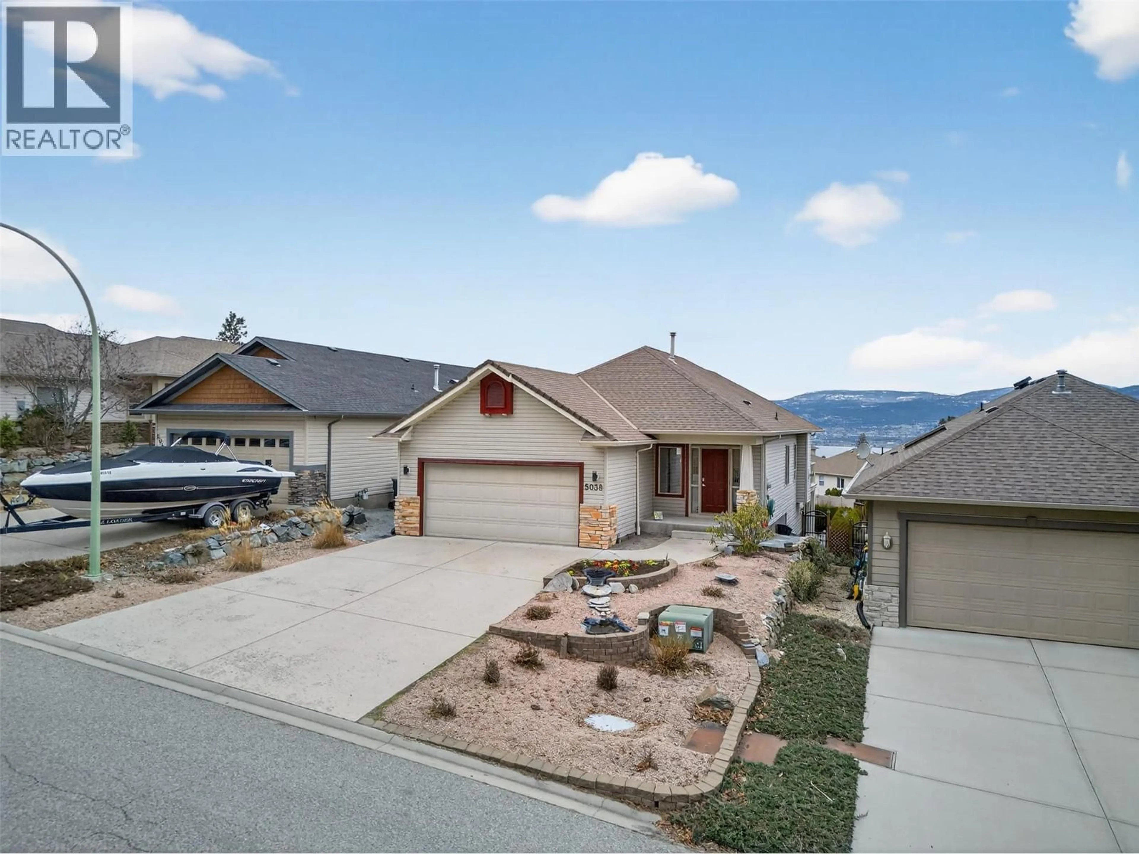 A pic from outside/outdoor area/front of a property/back of a property/a pic from drone, mountain view for 5038 SOUTH RIDGE DRIVE, Kelowna British Columbia V1W4W6
