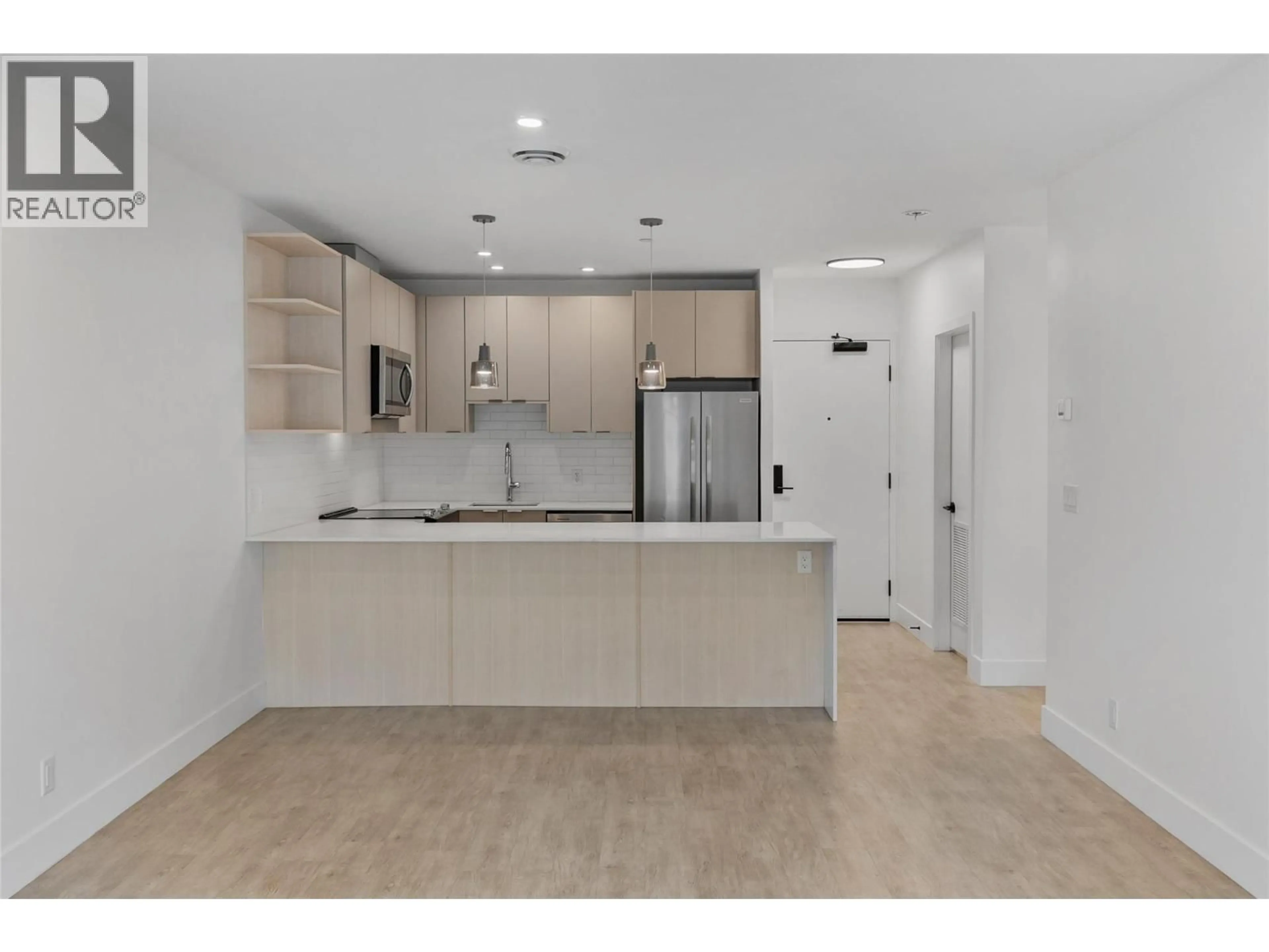 Open concept kitchen, ceramic/tile floor for 2204 - 1701 COURSIER AVENUE, Revelstoke British Columbia V0E2S3