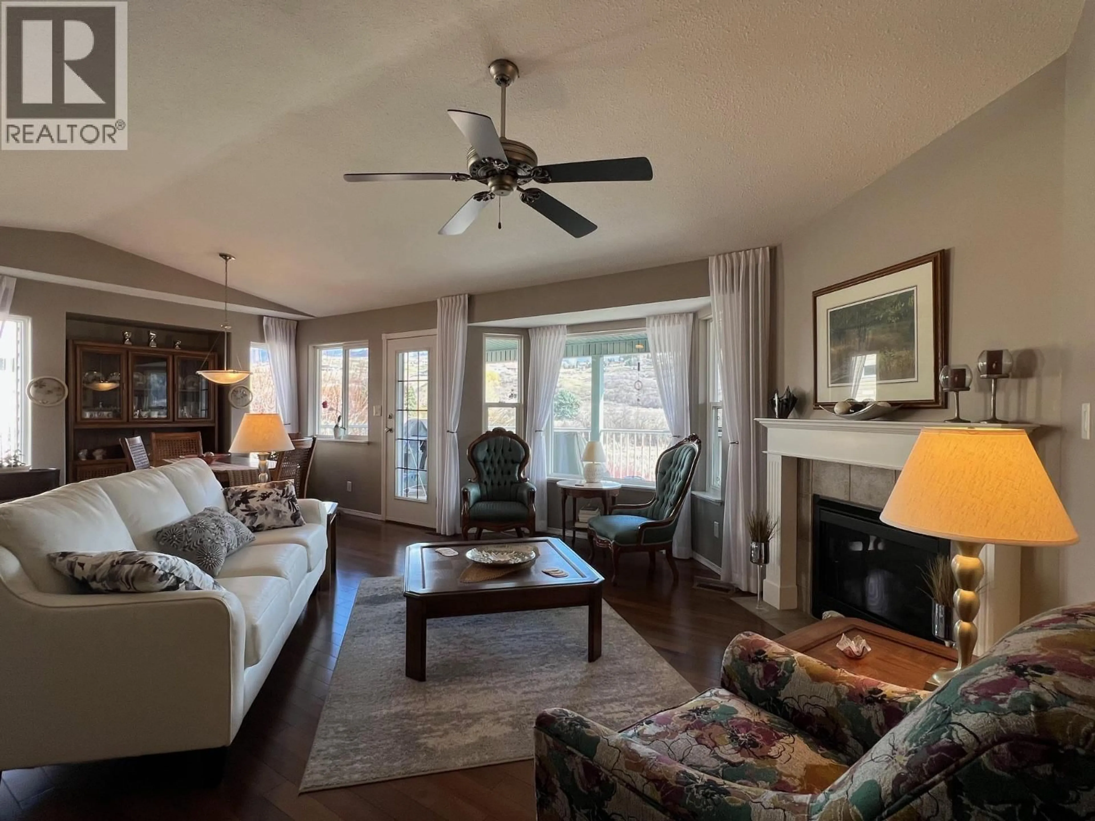 Living room with furniture, wood/laminate floor for 678 6TH STREET, Vernon British Columbia V1H1Z1