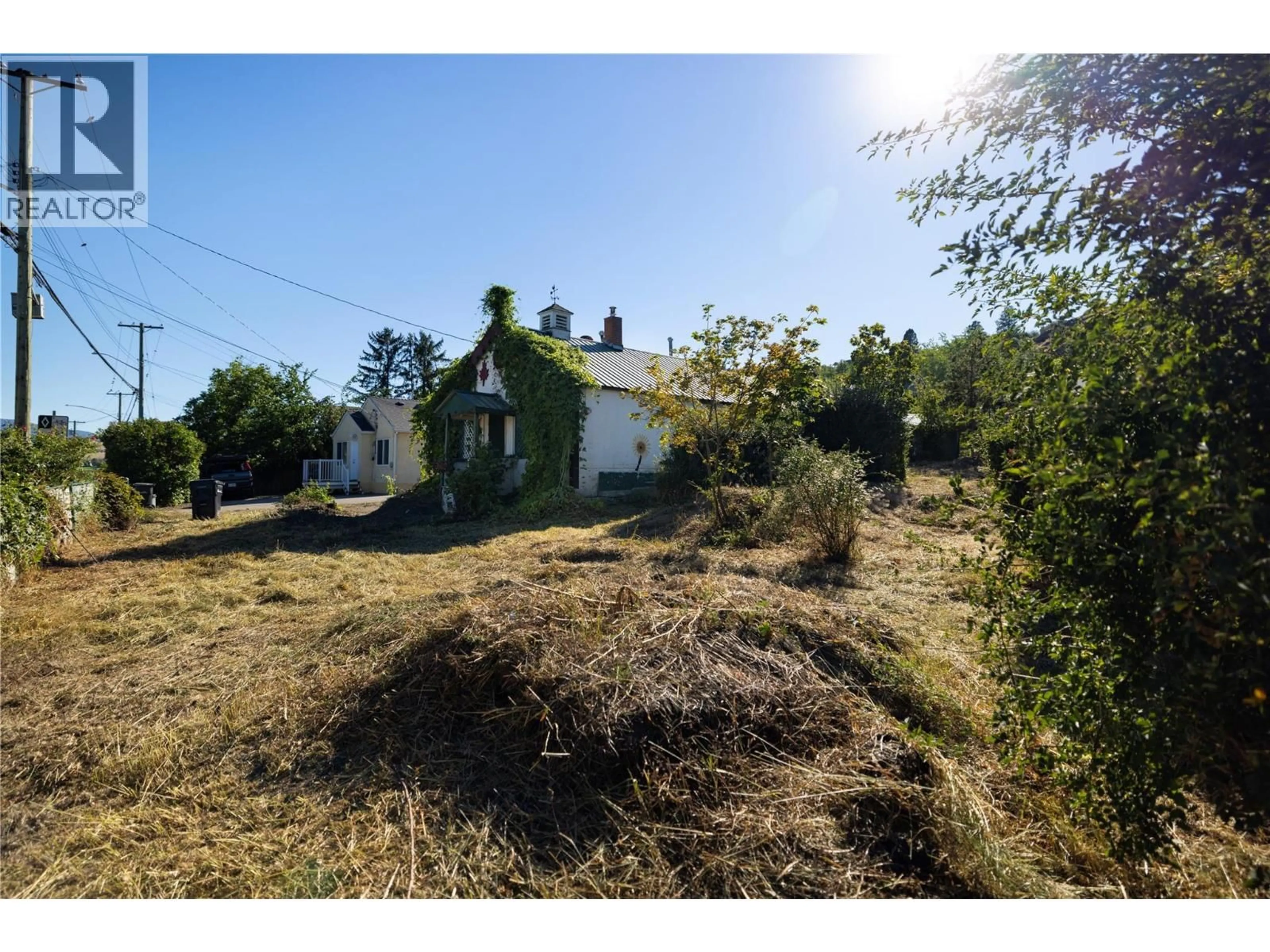 A pic from outside/outdoor area/front of a property/back of a property/a pic from drone, street for 3902 ALEXIS PARK DRIVE, Vernon British Columbia V1T6G9