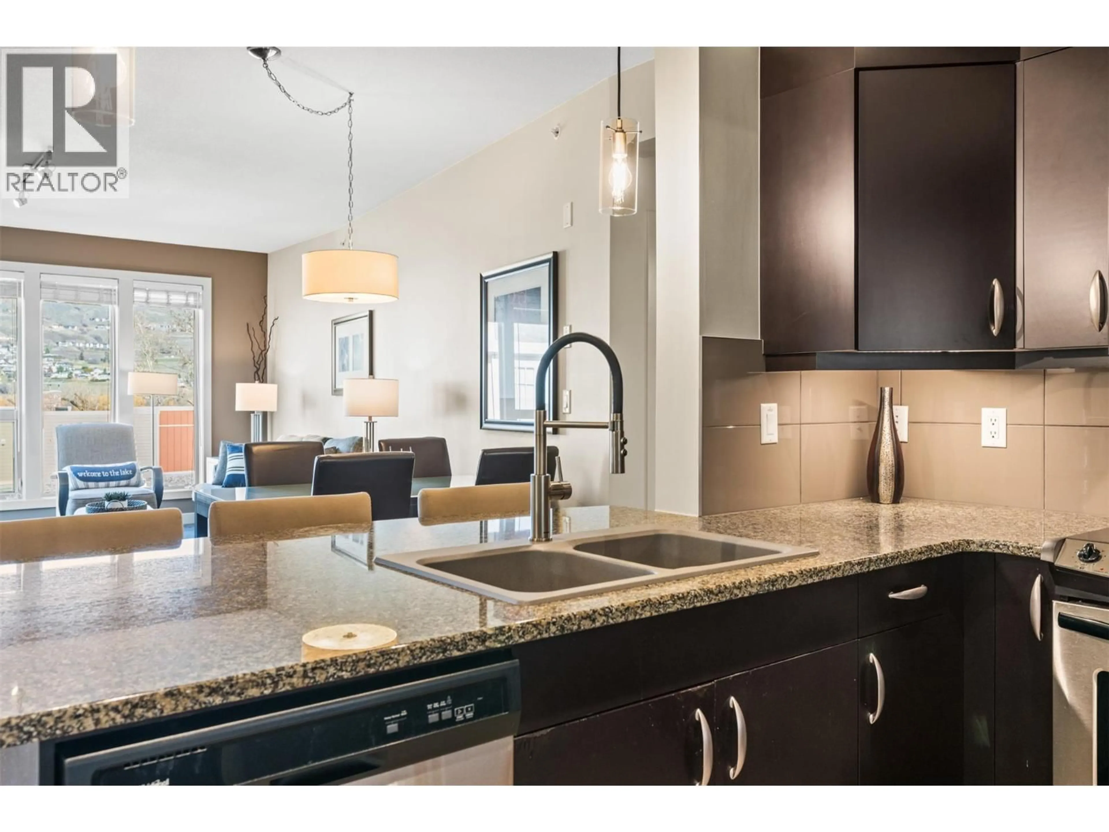 Open concept kitchen, ceramic/tile floor for 2401 - 7343 OKANAGAN LANDING ROAD, Vernon British Columbia V1H2J6