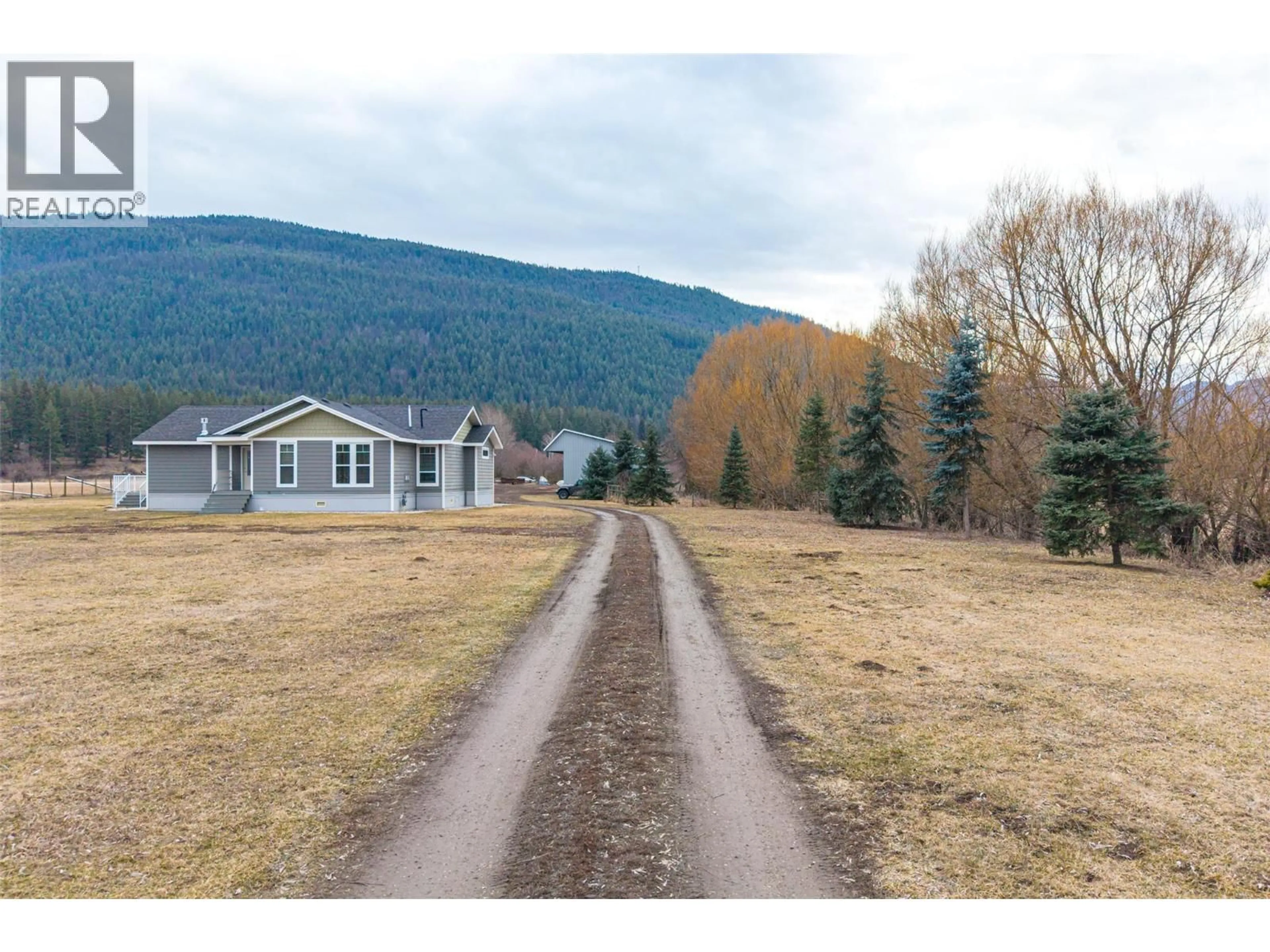 A pic from outside/outdoor area/front of a property/back of a property/a pic from drone, mountain view for 64 BLOOM ROAD, Lumby British Columbia V0E2G7