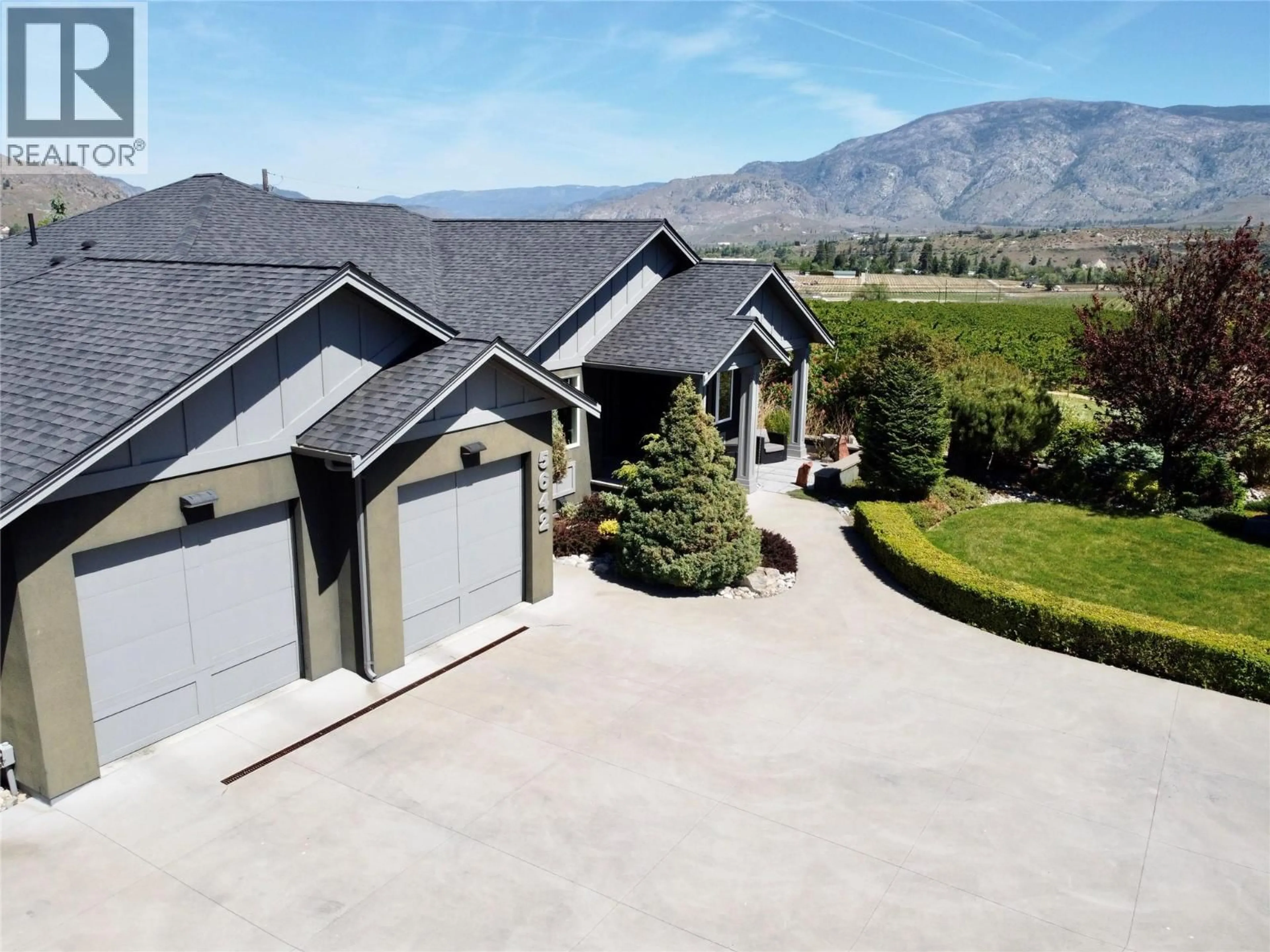 A pic from outside/outdoor area/front of a property/back of a property/a pic from drone, mountain view for 5642 YARROW STREET, Oliver British Columbia V0H1T0