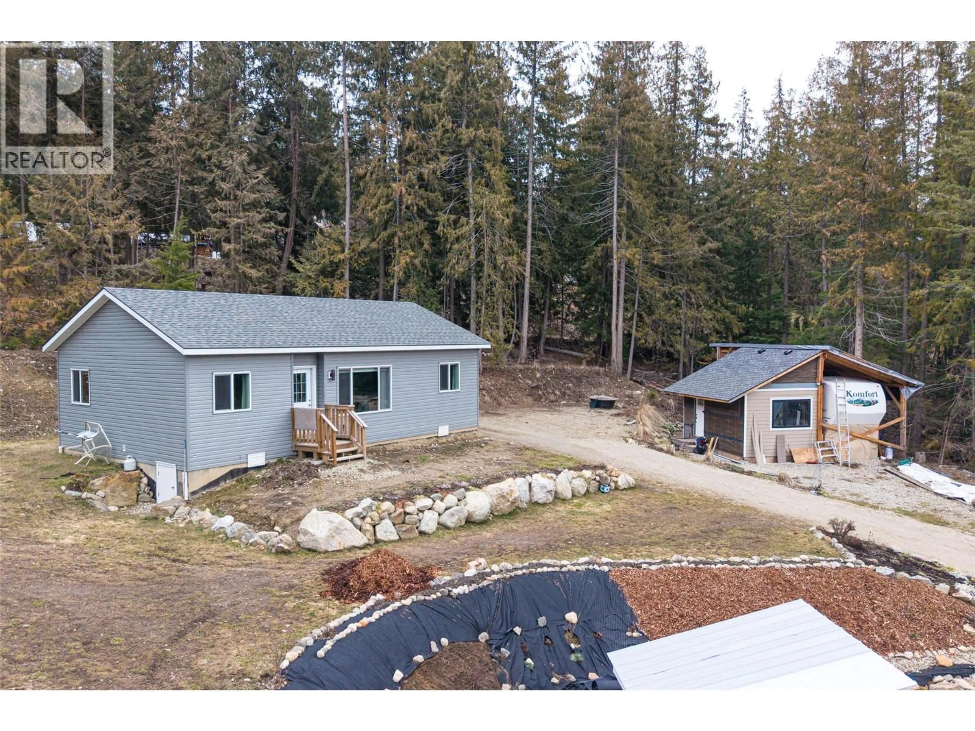 A pic from outside/outdoor area/front of a property/back of a property/a pic from drone, forest/trees view for 2655 COWAN ROAD, Sicamous British Columbia V0E2V0