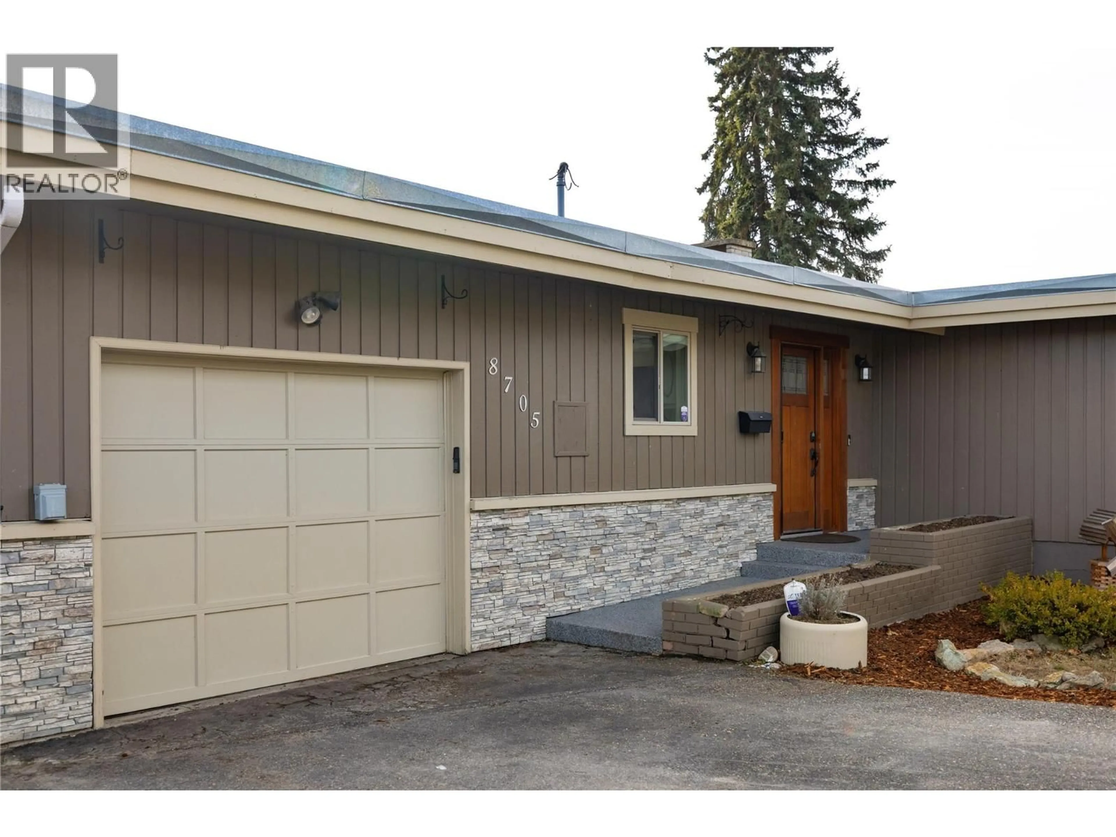 Home with vinyl exterior material, street for 8705 KALVIEW DRIVE, Coldstream British Columbia V1B1X2