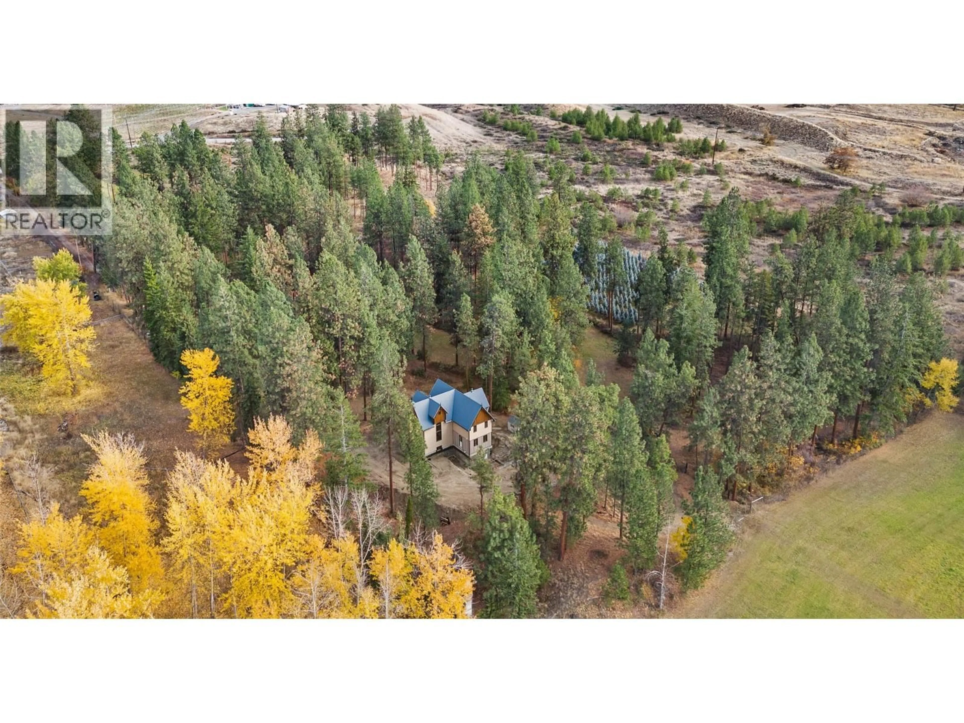 A pic from outside/outdoor area/front of a property/back of a property/a pic from drone, forest/trees view for 4670 STEWART ROAD EAST, Kelowna British Columbia V1W4C1
