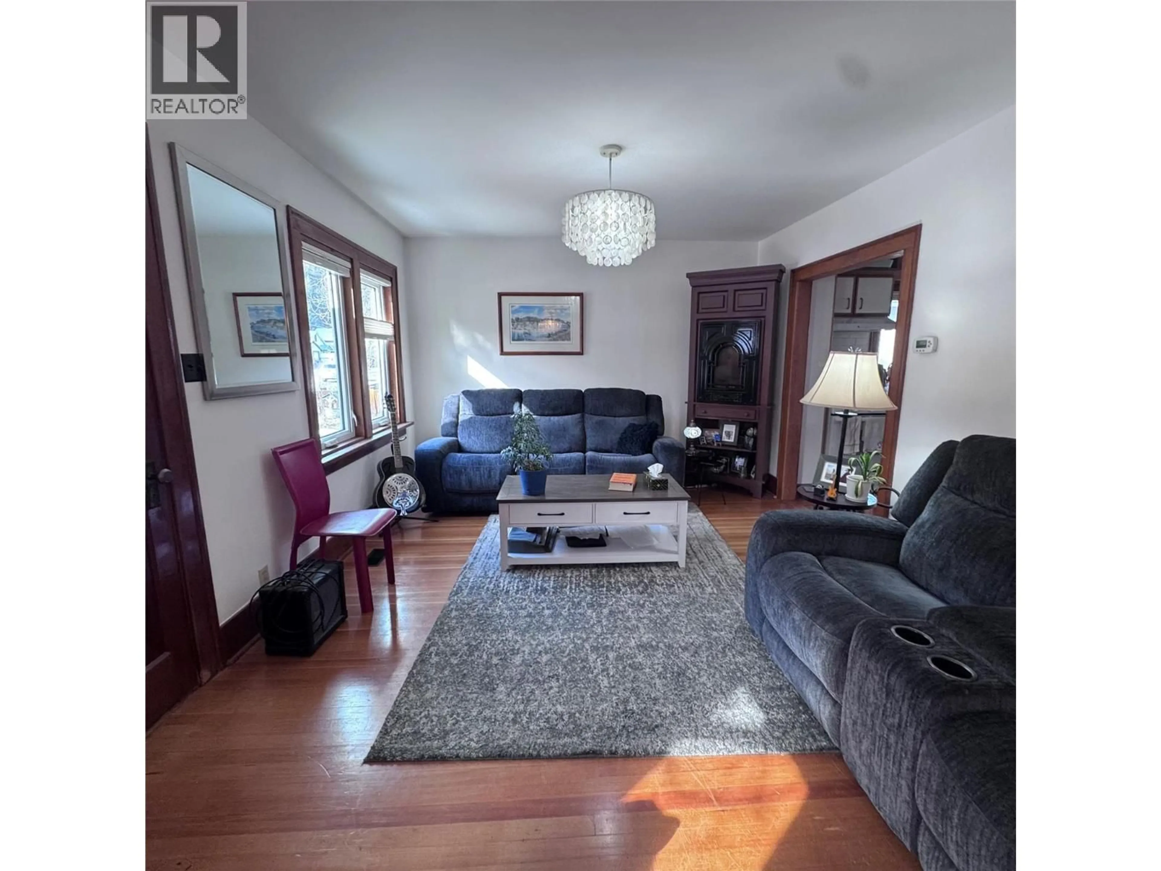 Living room with furniture, wood/laminate floor for 640 WALLINGER AVENUE, Kimberley British Columbia V1A2A1