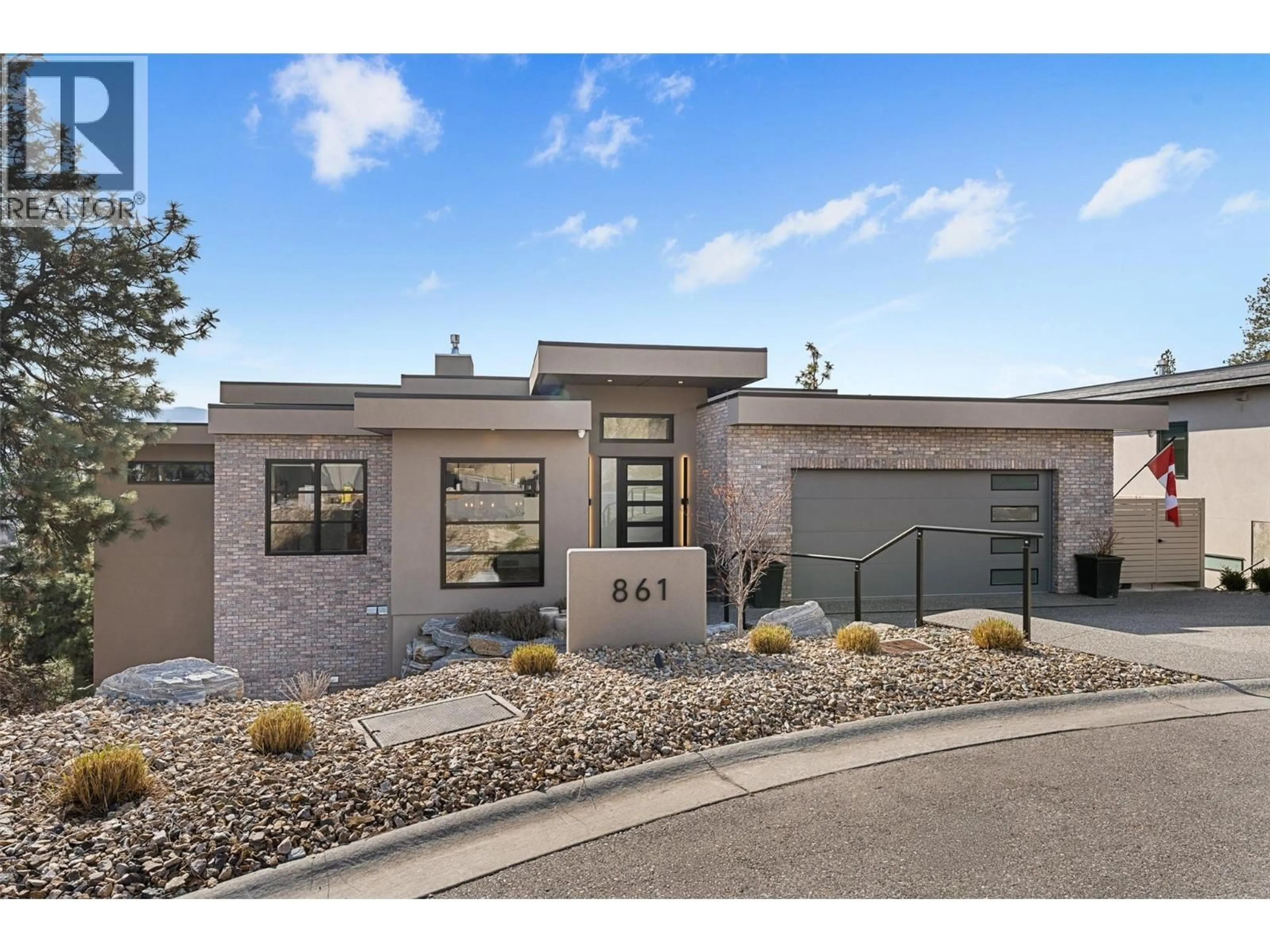 Home with brick exterior material, street for 861 BOYNTON PLACE, Kelowna British Columbia V1V2Y1