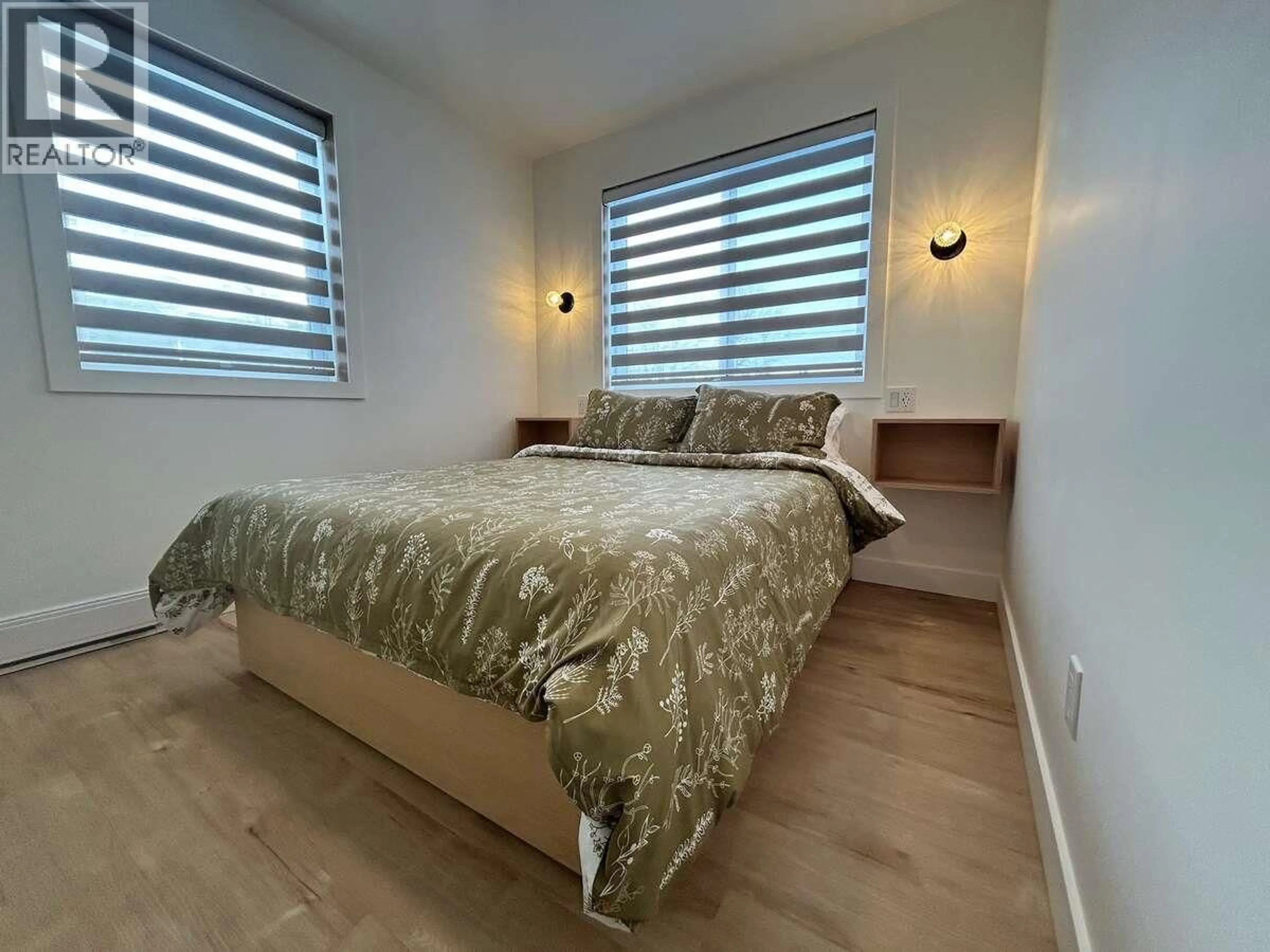 Bedroom with bed, wood/laminate floor for 9200 8 STREET, Dawson Creek British Columbia V1G3N6