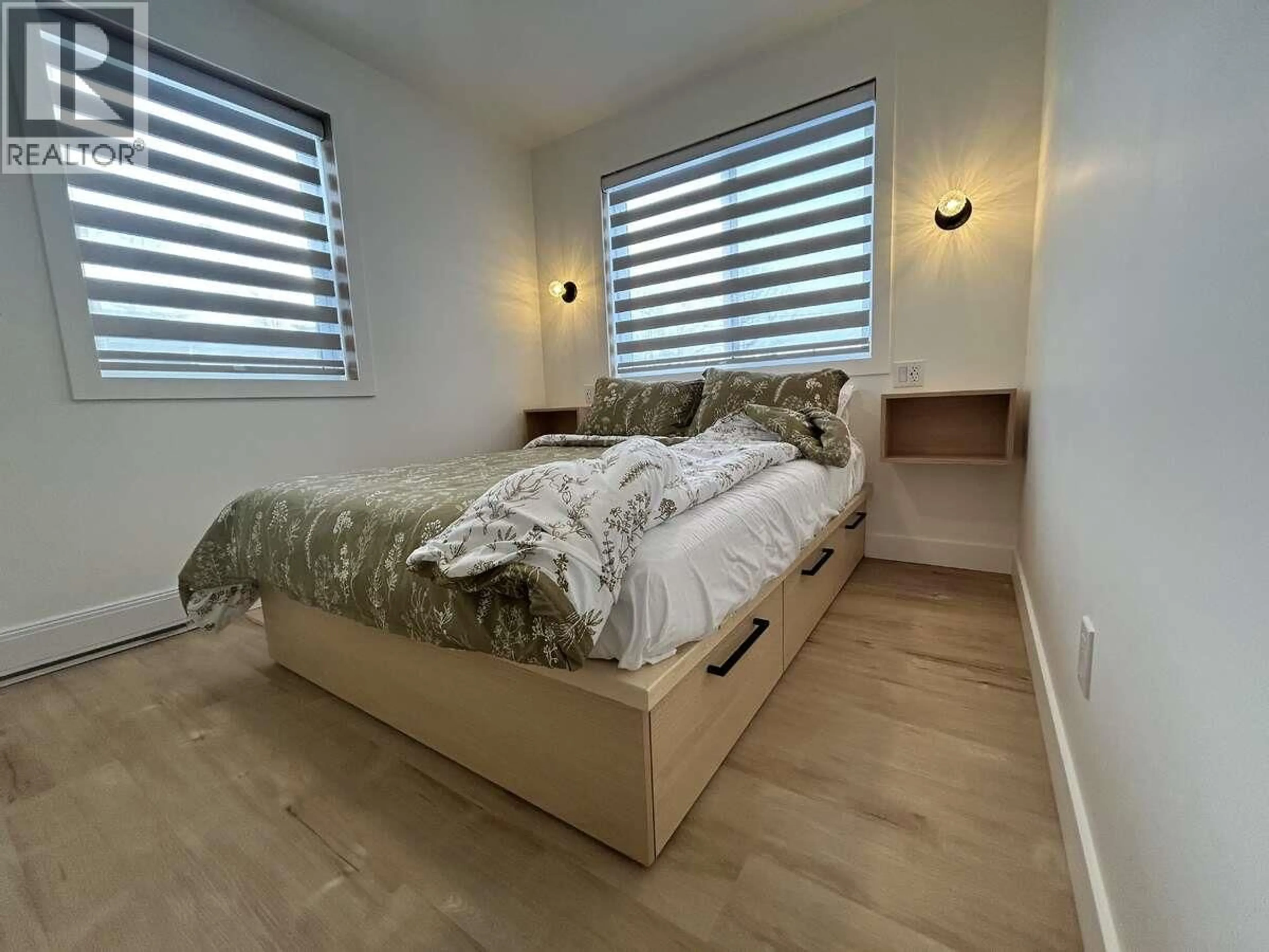 Bedroom with bed, wood/laminate floor for 9200 8 STREET, Dawson Creek British Columbia V1G3N6