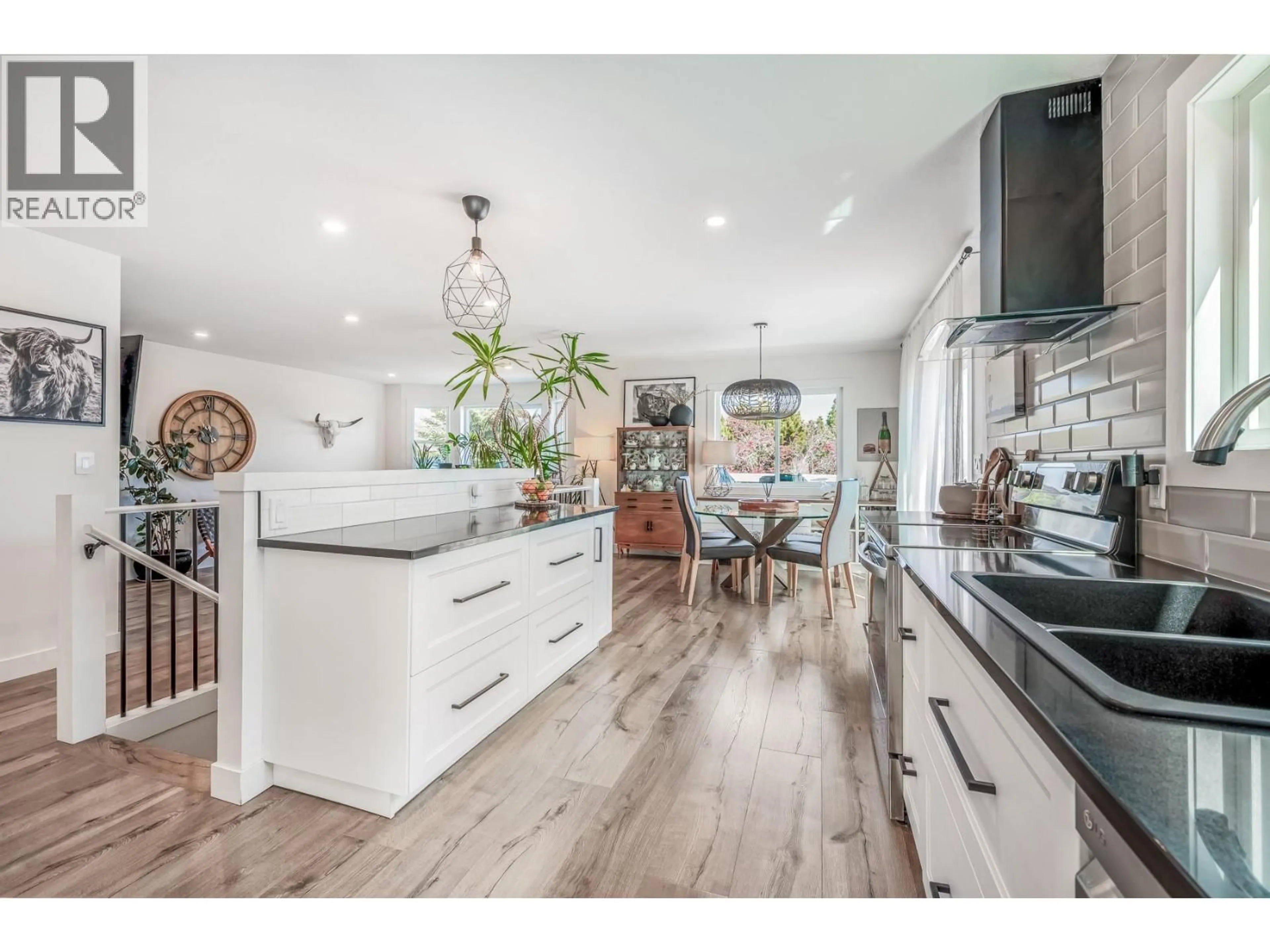 Open concept kitchen, wood/laminate floor for 1141 LYNDEN ROAD, West Kelowna British Columbia V1Z3L7